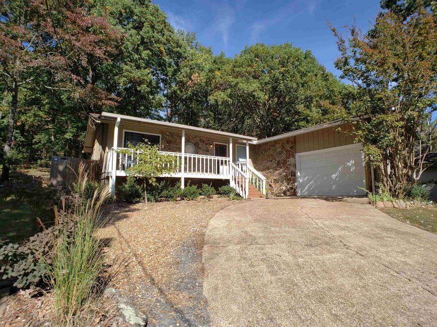 The living is easy in this nicely updated home in the heart of Fairfield Bay.  Featuring newly remodeled kitchen with granite countertops and new cabinets, updated bathrooms, and a newly fenced, private backyard.  The huge covered back porch is a great space for entertaining and cookouts.  There's even a doggy door so the little ones can tend to themselves while you're out on the lake or hiking the trails.  Split bedroom layout gives privacy to the master bedroom and the garage and bonus workshop room make for a great place to store all of your lake toys.  Whether for full-time living or a weekend getaway, this home is ready to make many years of memories for you and your family.  Give us a call today to schedule a showing.