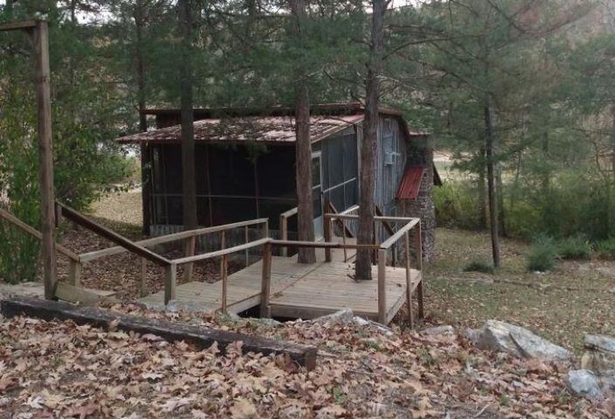 Rustic Cabin located near South Fork Spring River! Prime location for a vacation getaway or VRBO! This idyllic Ozark getaway has a creek and resides on 2 lots with plenty of room to make perfect just for you! Screened in porch! Cozy stone basement sleeps 8! Furniture and appliances are included!! Basement is not included in total sqft. Must See!!