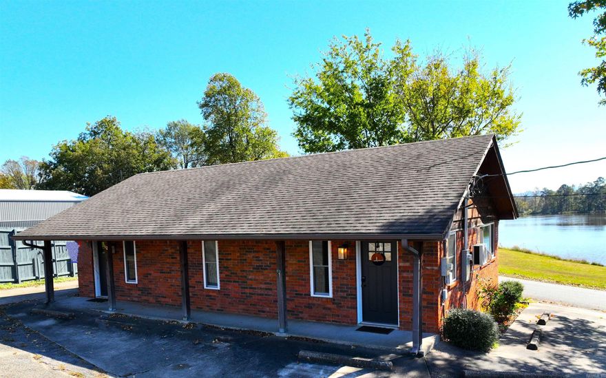 Fully Remodeled Office Building with two office rentals.  Great visibility in high traffic area. Restaurants, gas stations, motels, retail, residential subdivisions, and a variety of businesses neighbor this property for complete client convenience.  Property also offers tranquil setting overlooking Cox lake, complete with ducks, geese, and fish.  One side currently rented, and sale subject to acceptance of existing lease.  Expenses include taxes, insurance, and paid water.  Lessees pay power.  No maintenance currently since recently remodeled.