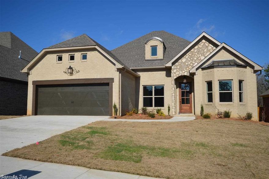 Another beautiful NEW home built by Kevin Keathley in the Wildwood Ridge Subdivision. This open floor plan features 4 bedrooms with 2 1/2 baths, Brick/Stone front exterior, coffered ceilings, tankless hot water heater, stained kitchen cabinets, rich hardwood floors, sink in the laundry room,  plenty of storage and a stair case in the garage instead of a pull down set of stairs. Special taxes pays to maintain the entrance and provide general LAWN CARE for the home owners.