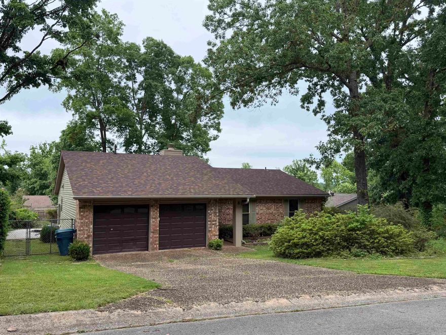 Welcome to 8 Markham Place Cir located in Little Rock! Make your appointment today to come check out this one-owner home located in a great neighborhood just minutes from shopping and dining! Situated on a spacious fenced lot, major updates include, a new roof in 2025, newer vinyl dual pane windows, vinyl siding, and a newer water heater giving buyers peace of mind on the big-ticket items. Both bathrooms have been nicely updated with solid surface finishes and glass sliding doors.  Enjoy the oversized living room featuring vaulted ceilings and a cozy gas fireplace. Functional layout includes a kitchen with adjoining dining area, ideal for everyday living and entertaining! With just a little fresh paint and new flooring, this home can truly shine making it an excellent option for first-time buyers, investors, or anyone looking to build instant equity!