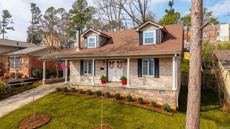 Storybook charm throughout this adorable 3 bedroom, 2 bath traditional brick home!  Inviting front porch welcomes you with double painted doors.  Inside entry is flanked by the formal dining room and a welcoming, cozy living space with a fireplace and built-ins.  Open concept kitchen/living with stainless steel appliances and a quaint breakfast bar.  Primary bedroom and full bath on the main level offers easy living! Formal dining is filled with natural light and the chair rail adds a lovely touch. Hardwood floors throughout, including the stairs.  Two spacious bedrooms up with a shared full bath.  Absolutely gorgeous home with lots of curb appeal!  New landscaping and zoysia in the front, plus a fully fenced, tiered, landscaped and mulched back yard with a covered deck.  One car carport with storage space for convenience.  New roof, gutters/eaves, rear glass exterior door, & vent-a-hood in 2023.  HVAC 2021. All new interior paint 2025.  Perfection in the heart of Kingwood zoned for Jefferson Elementary.  Come see!  This won't last long!