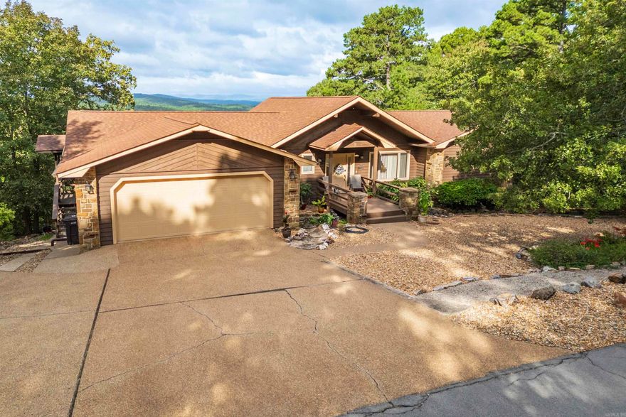 Mountain View Rustic Retreat with Modern Comforts - Welcome to your serene mountain-view haven!  This beautifully maintained two-level lodge style home has an abundance of windows offering great views!  Vaulted ceilings on main living area create a sense of spaciousness, while the updated kitchen features modern finishes.  On main level you will enter into a great room with fireplace; dining room; updated kitchen (2024) with granite counters/subway tile backsplash/sink/microwave/oven (2025); laundry room; 1/2 bath for guests; master bedroom and bathroom (updated 2024); and sunroom (183 SF not included in total square footage).  Downstairs is a family room; two spacious bedrooms; full bathroom; and 326 H/C workshop with garage door (not included in square footage).  Recent updates include new roof (2023); LVP flooring on main level (2025); new garage door (2023); new water line (2022); water heater (2023); and Rheem Heat Pump (2021).  Whether you're sipping coffee while gazing at the mountains or hosting family or friends, this home delivers comfort, charm and versatility in every corner.  Agents see remarks for additional details.