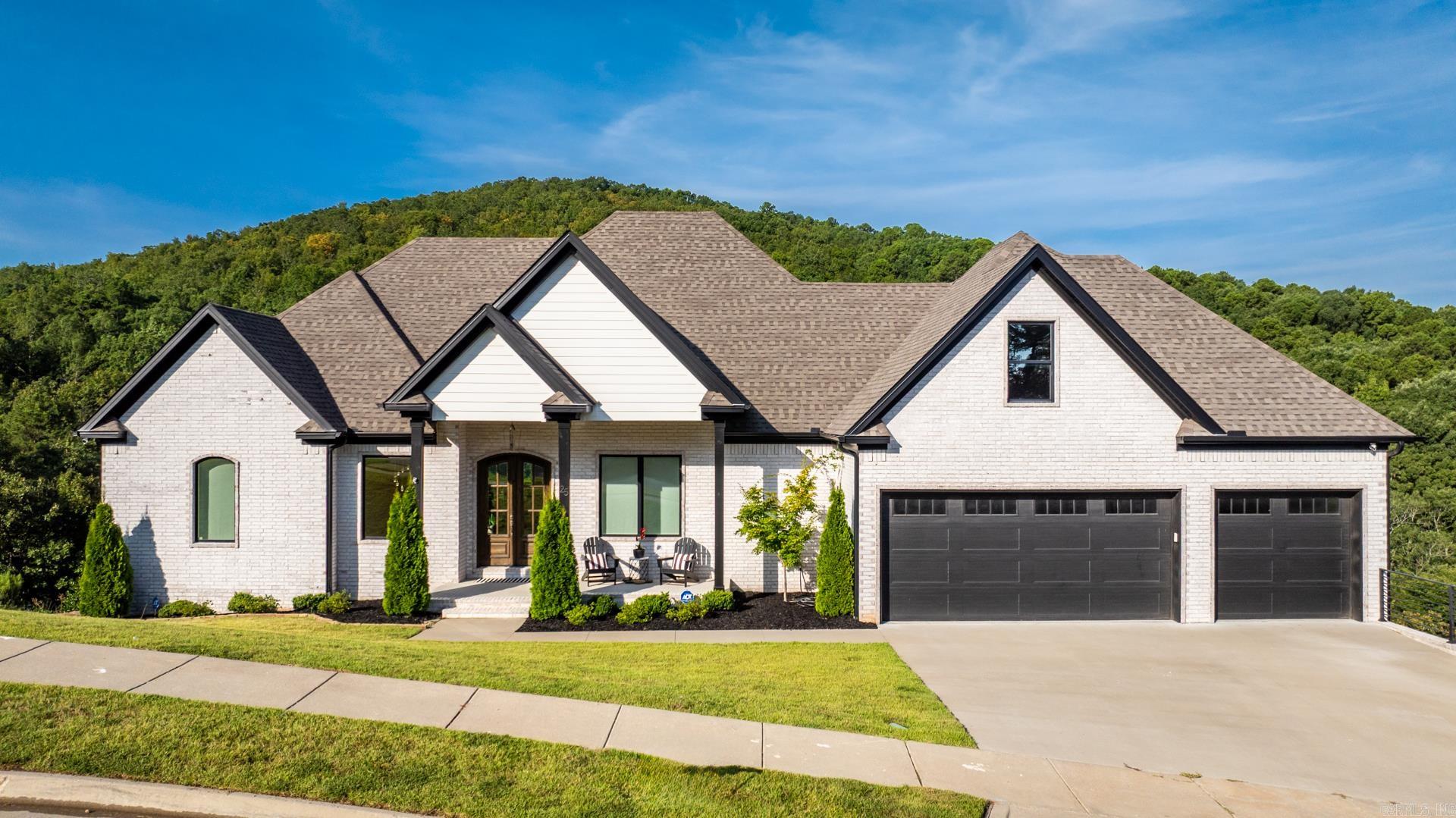 Welcome to your dream home in the prestigious Falstone Subdivision of Chenal Valley! This immaculate 5-bedroom, 3.5-bath residence feels like new construction and offers one of the most scenic settings in all of West Little Rock. Backing up to a wooded mountain, enjoy breathtaking panoramic views from two expansive decksāperfect for relaxing or entertaining. Inside, you'll find a chefās dream kitchen with a gourmet open layout, ideal for cooking and gathering. The main level features the luxurious primary suite, a beautifully designed custom laundry room, and a spacious 3-car garage. Downstairs includes four generously sized bedrooms, a large second living area, and a versatile bonus room perfect for a home theater, gym, or playroom. This is a rare opportunity to own a like-new home in one of Chenalās most sought-after neighborhoods. Experience refined living with natural beauty at your doorstep. Donāt miss it!