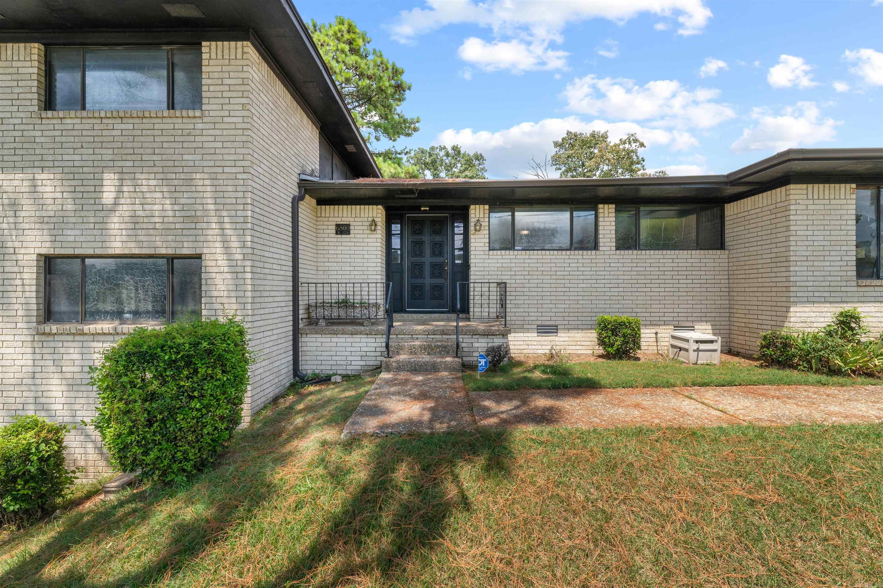 Ready for a retro vibe spacious 4-bedroom, 3.5-bath home offers nearly 2,900 square feet of versatile living space on a prime corner lot in Midtown Little Rock. The main floor creates a natural gathering space, with a generous living and dining area, a cozy hearth room with a see-through fireplace, and an updated kitchen complete with granite countertops, a gas range, and new appliances. Upstairs, the oversized primary suite offers the space and privacy parents will love with so much natural light. Downstairs, two more bedrooms, a full bath, and a large laundry room provide plenty of room for kids or teens. A separate bedroom with a private entrance and en-suite bath is perfect for guests, in-laws, or even a live-in nanny.The sunroom is a bright bonus space ideal for play, homework, or family game nightsārain or shine. A two-car garage, extra parking, a whole-house generator, and a new roof (to be installed with accepted offer) round out the features that make this home ready for your familyās next chapter. New roof to be installed with acceptable offer.*SEE AGENT REMARKS*
