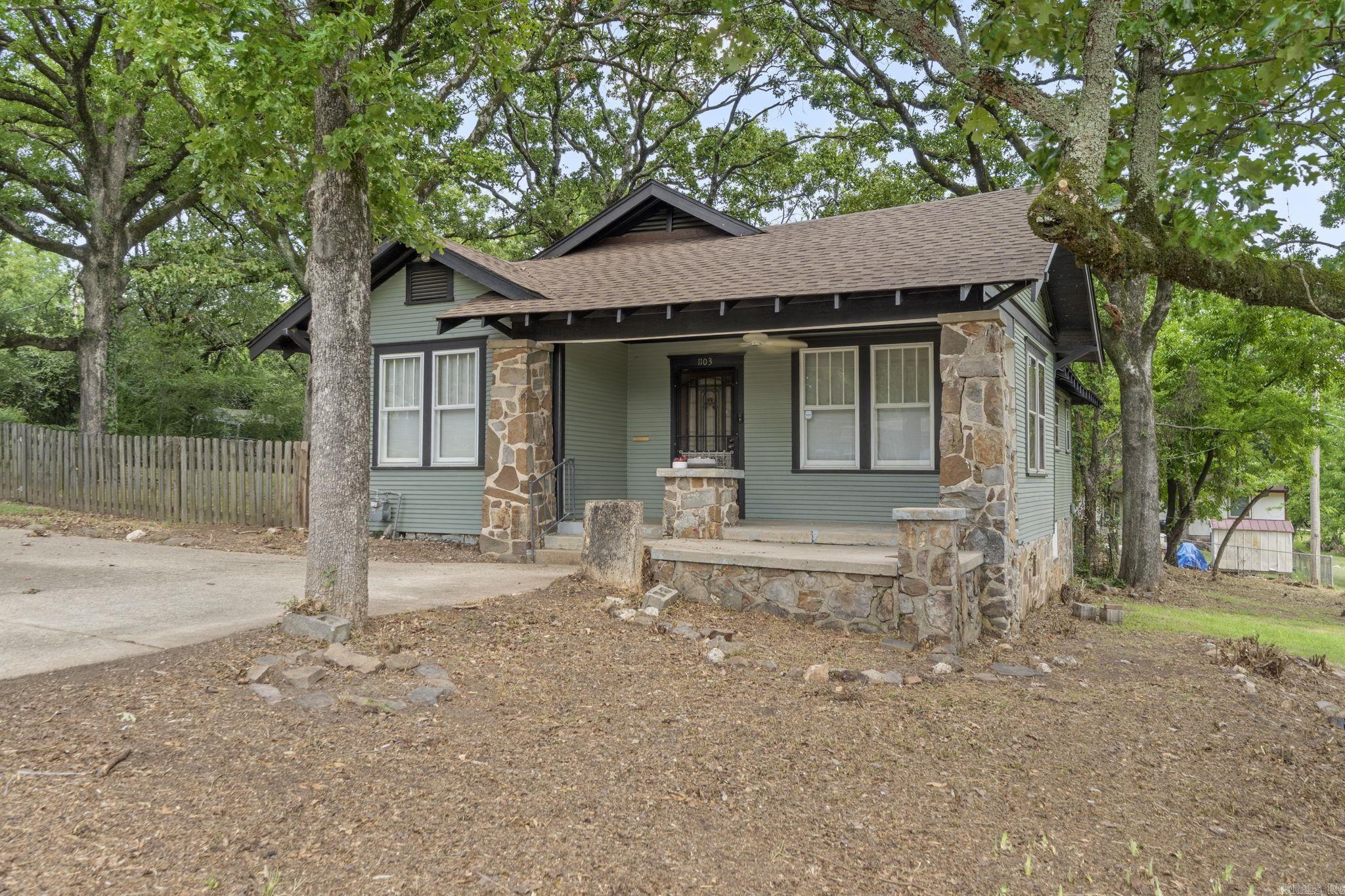 Charming 1920 Craftsman on TWO lots. Step back in time with this beautifully maintained home with tongue and groove hardwoods. This home features a new roof in May of this year, refinished bathtub, and mini-splits in '24. Situated on two spacious lots, this property offers room to grow, garden, or simply enjoy the extra outdoor space. Classic architectural details, a welcoming front porch, and mature trees make this a rare find. Don't miss the opportunity to own a piece of history with room to make it your own.