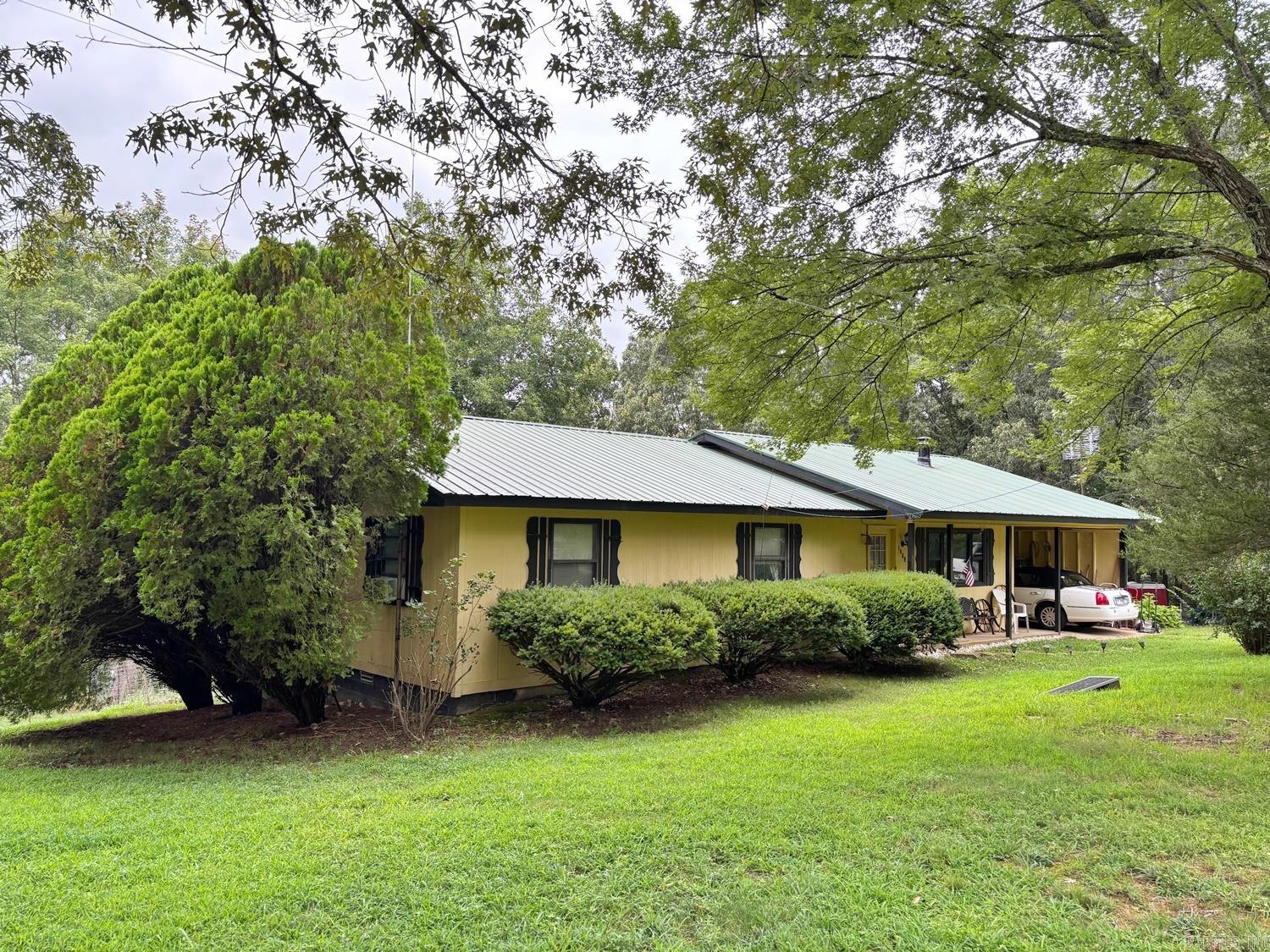 Great location on this 3BR 2BA ranch home between Harrison & Bull Shoals Lake! Living room with wood stove, large kitchen/dining combination, large laundry room & covered deck make for comfortable living. Parklike setting on 8 acres m/l has large scattered trees in front with woods behind. Bull Shoals Lake is within 20 min. Branson, MO, Table Rock & Taneycomo Lakes, White & Buffalo Rivers and numerous hiking, camping, swimming, fishing, hunting & sight seeing venues are within an hour or less. A great spot to call Home!