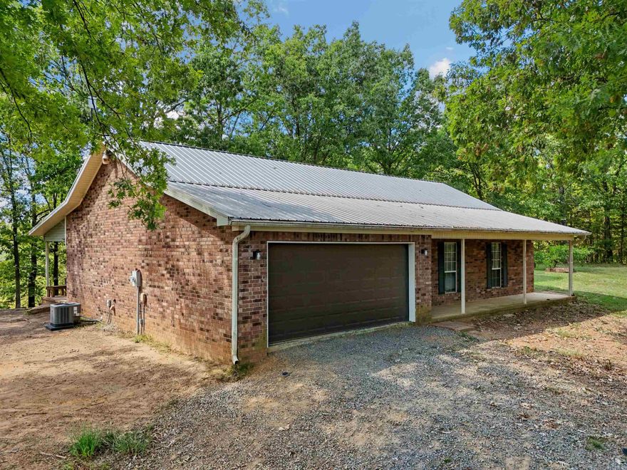 Nestled in the trees lies this beautiful 3 bed, 2 bath home on about 1.6 acres. Amenities include a metal roof, vaulted ceiling in living area, new HVAC, new countertops, new oven, new dishwasher, new hot water heater, sun room, and views for days! Be sure to check out the 3D tour and aerial drone footage.