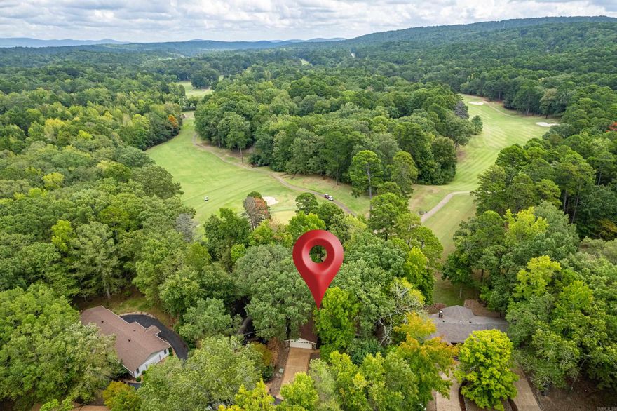 This could be your new home on the DeSoto Golf Course! Complete with a view of the 15th green and right close to the 16th tee box! This charming residence features high-volume ceilings with beautiful, exposed beams, creating an open and airy feel. Cozy up by the fireplace in the inviting living room, or enjoy cooking in the updated kitchen, complete with an upgraded propane cooktop, double oven, and elegant granite countertops.  Step into the spacious Arkansas room, a recent addition that includes a separate entrance and bath—perfect for a third bedroom or guest suite. Immaculately maintained this home 2023 HVAC, tons of storage, room for an office, 2 water heaters, newer deck, the list goes on! This home is a golfer's paradise, combining convenience and comfort in a serene setting. Don't miss out on this unique opportunity to live on one of the best courses in the area! you will be close to the West gate, shopping, and all of the amazing amenities the HSV has to offer!