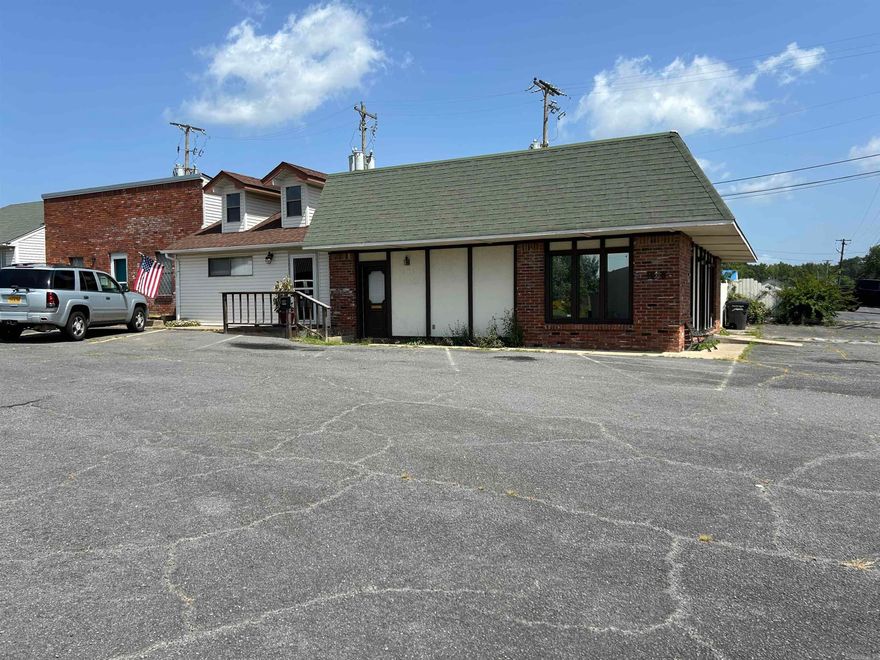 SUPER opportunity for a small business and space inside also to live in the back area ,Two ways to enter the building front door and side door ,building has lots of potential for multiple uses ,HALF bath and kitchen area in office area 3 Bedrooms also in back of space with handicapped bathroom with special walk in jetted tub and and full kitchen with  granite counter tops breakfast bar and dining area with nice appliances.High traffic area in downtown of city and close to grocery store and restaurants.Great location for many small private businesses .