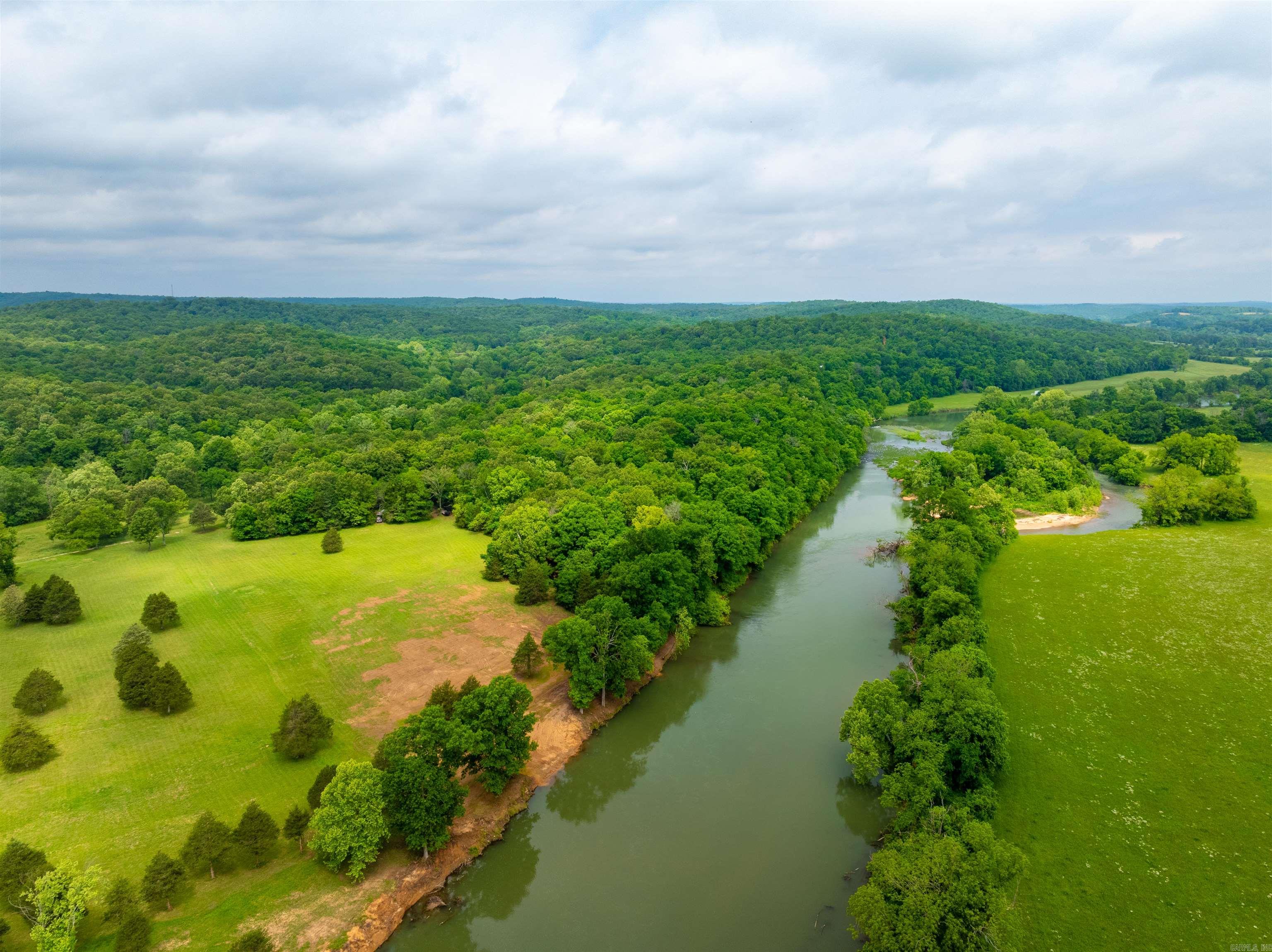 Spring River Lot – Ready to Build! Just Outside Hardy, AR If you've been dreaming of owning property on the Spring River, here's your chance! This prime river lot comes ready to build, with water and electricity easements in place, a successful perk test, and an elevation certificate showing it's 2 feet above a 500-year flood level (per seller)—a rare find! Located just minutes from historic downtown Hardy, this lot offers stunning views overlooking the beautiful Spring River. Whether you're looking to build a vacation cabin, forever home, or weekend getaway, this spot has everything in place to get started right away. Address: 169 Spring Acre (new so it will not GPS yet) Utilities Easement Perk Test Completed Elevation Certificate on File Peaceful Setting with Gorgeous River Views