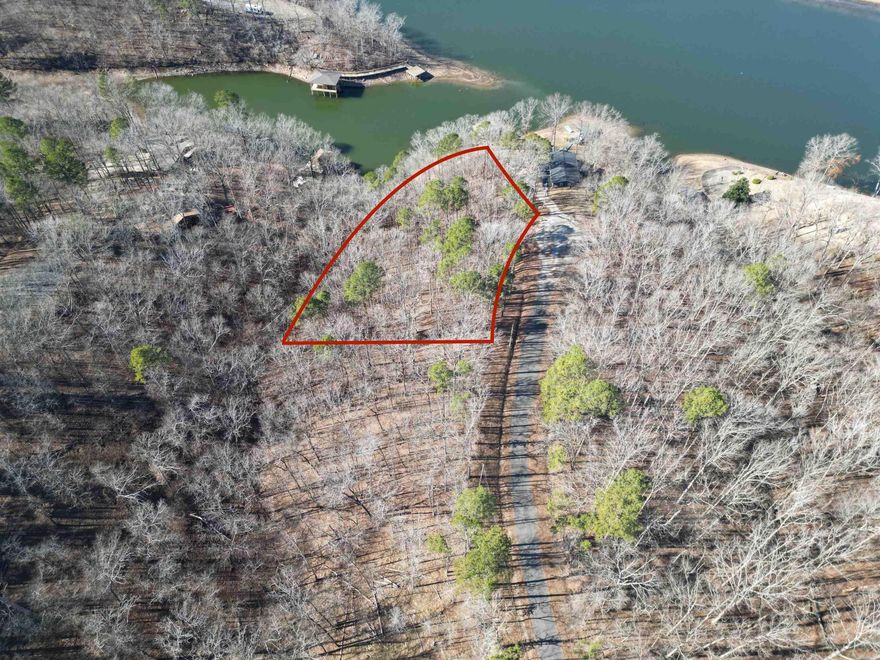 This beautiful lot offers approximately 199 feet of Lake Catherine frontage and is tucked away at the end of a quiet cul-de-sac. Sloping toward the water, it provides an ideal setting for a future home designed to take advantage of the lake views. Located in Diamondhead, this property offers a peaceful atmosphere with abundant wildlife and a true sense of privacy, perfect for enjoying lake living at its best.
