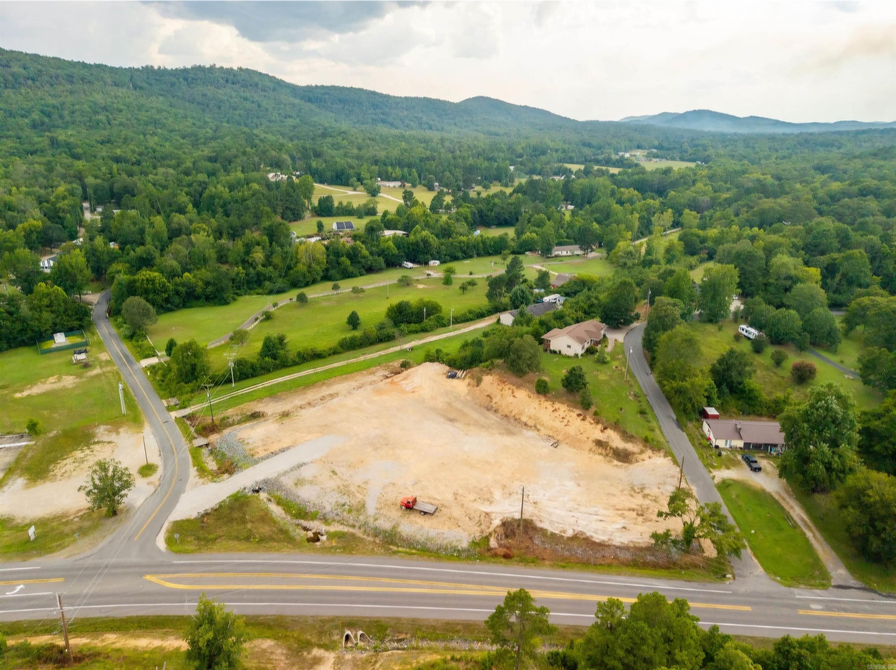 Excellentl Opportunity for approximately 2 acres on Highway 7 North- cleared, leveled and ready for your next commercial building project!  Features approximately 330 ft of Hwy 7 frontage plus additional paved access on two other streets, Walnut Valley Rd (193 ft ) and Jarrell Rd (110 ft ).  Utilities include North Garland County water, natural gas, existing septic, and electric at the street.  High Traffic location with estimated 10,000 +/- vehicles per day.  Less than 3 miles north of the new bypass roundabout and only 5 miles to Hot Springs Village. main entrance. Outside the city limits for added flexibility.  Owner/Agent