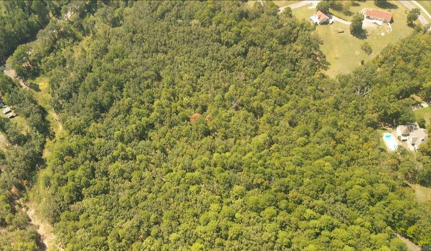 8 ACRES of PRIVACY IN THE TREES in a convenient location with utilities to the property. Hardwood and Pine timber with deer sign that would make this a great hunting property too.  Come see this in person and fall in love for yourself.