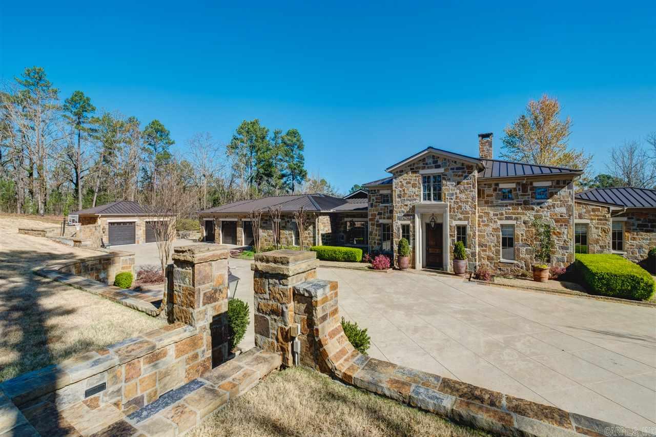 Picturesque outside & in! Panoramic 10 acres of water, landscape & wooded views. Coffered ceilings, custom millwork & natural lighting adorn the 3 primary living areas (2 w/fireplace), open kitchen w/2 gas & 2 electric ovens, culinary island w/seating for 8. Master & 3 suites offer a view & tankless hwh. The Master dressing area is amazing. Downstairs offers sleeping quarters, gathering area & storage. 3 car garage is massive, workspace, art area, Internet. 2 car det w/HVAC & water. A must see!