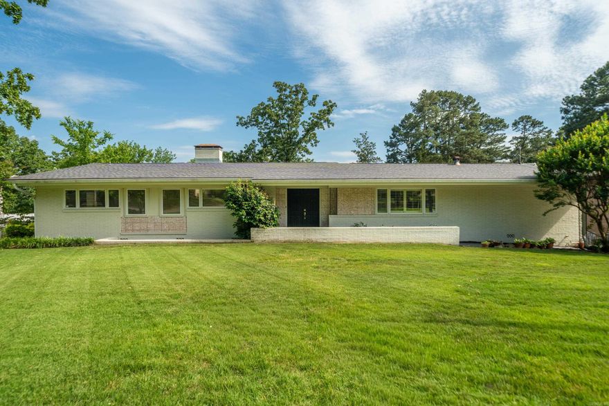 Welcome to this stylish mid-century modern home offering plenty of room to live, work, and entertain! The spacious kitchen provides ample prep space, storage, and room for gatherings both large and small. Featuring 4 bedrooms, 2 full bathrooms, and 2 half bathrooms, this home offers a flexible layout to fit a variety of needs. The lower-level den includes a wet bar and fireplace, creating the perfect setting for game nights, movie marathons, or relaxing evenings at home. Situated on nearly a half-acre lot, the property also includes additional storage space and a greenhouse ready for gardening, hobbies, or year-round plant care. With character, functionality, and unique features throughout, this home is ready for its next chapter!