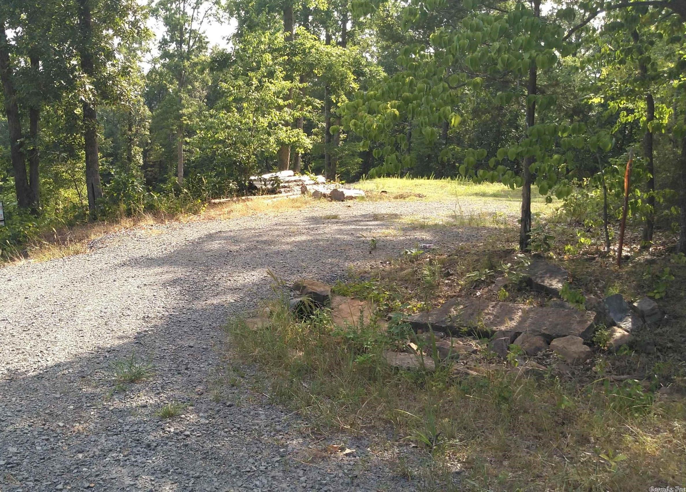 Looking for the perfect place close to Choctaw Boat ramp & somewhere you can park your RV all year...This has a small building pad and a circle drive way waiting for you, This lot is less than 2 miles m/l to Choctaw Boat ramp & access to Greers Ferry Lake! Build your lake Cabin or park your camper or RV. There is water & power at the road too! There is a circle driveway and a pad already on the property. Our #1 call is lots for RV parking. Some Owner Financing Available.