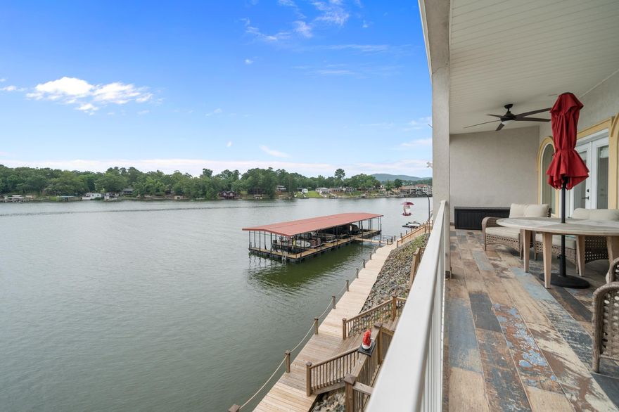 Experience luxury and tranquility in this beautiful 3-bedroom, 3.5-bath condo located on the serene shores of Lake Hamilton. This walk-in level condo, is a smart home, and boasts impressive vaulted ceilings and is designed with elegance and comfort in mind. Interior Features include a spacious living room which features a cozy fireplace, perfect for relaxing evenings. The open floor plan creates a welcoming space for entertaining and is perfect for family gatherings. The large, modern kitchen is a chef's dream, complete with a breakfast bar and a wet bar on the upper level. The kitchen's design promotes effortless cooking and socializing, making it the heart of the home. Both levels of the condo offer covered decks/patios, providing the perfect setting for outdoor entertaining or peaceful relaxation. Enjoy morning coffee or evening cocktails while taking in the stunning lake views. Don't miss the opportunity to own this exceptional lakefront condo. Elevator in this complex, which allows you to access both levels of this unit. This unit also includes 2 new HVAC units! Contact us today to schedule a private viewing and experience the charm and luxury of Lake Hamilton living.