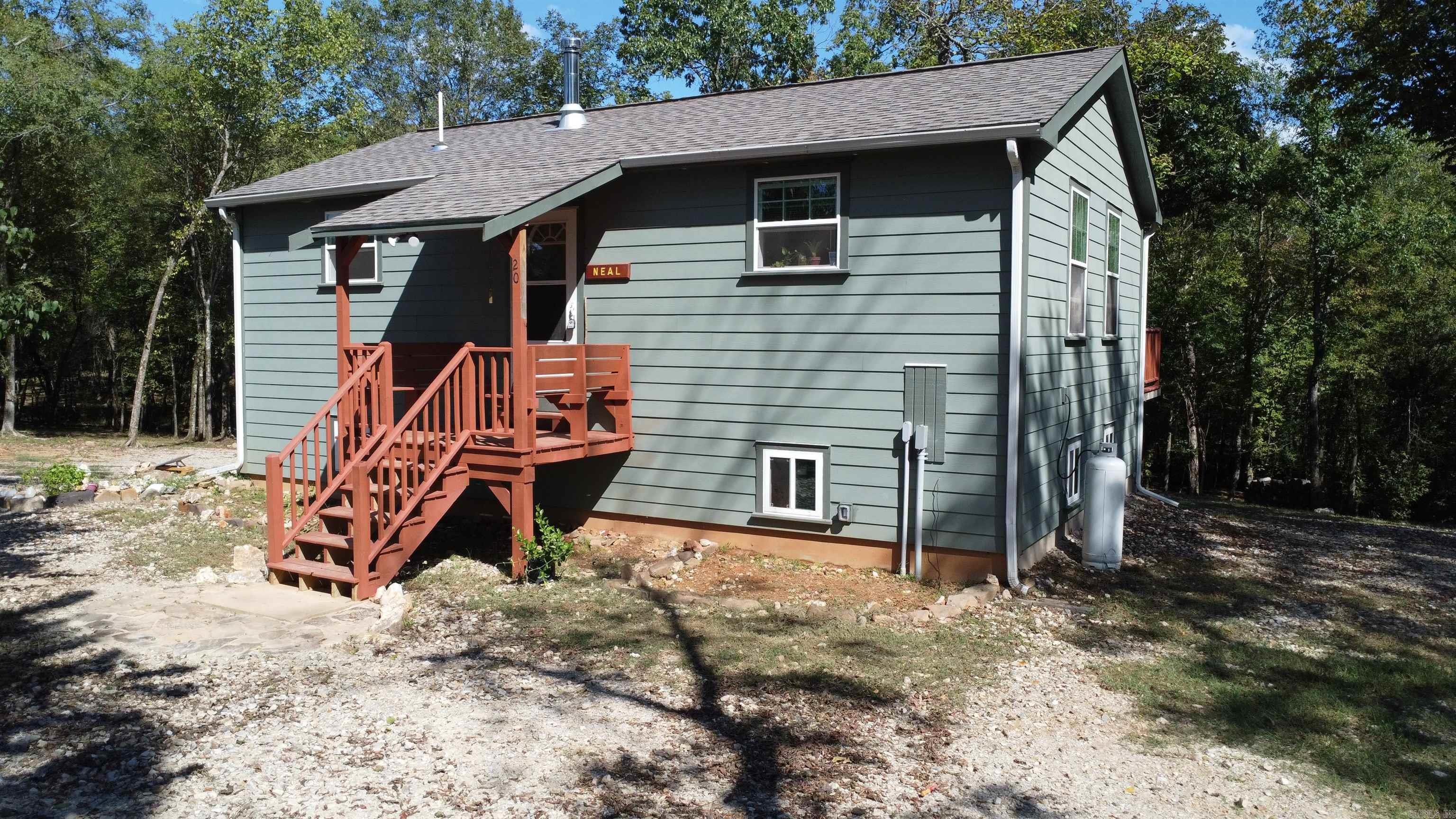 3 bedroom, 2 bath bordering Ouachita National Forest on the east. This custom built home has 1000 sq ft upstairs and 1000 sq ft in the basement with a 19x22 garage/workshop sitting on 4.26 acres. Located on the north side of Lake Ouachita in a retreat that has access to Irons Fork Creek. Exterior of the house has hardy board, architectural shingles, and 2 porches. There is a nice garden area, a creek, and partially wooded. Plenty of room inside with lots of natural lighting. Basement is perfect for the storm watchers, has the potential to be a game room/family room/office space/ or more bedrooms. Wood burning stove heats upstairs and down. Do not miss out on this one of a kind. Call today for an appointment.