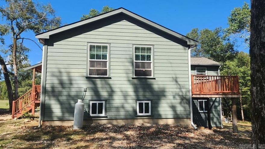 3 bedroom 2 bath with 2000 sq ft living space joining Ouachita National Forest in Story AR. Built in 2024 and sits on 4.26 acres with a creek. Lots of natural light. 19x22 garage/workshop. Architectural shingles, Hardie board exterior for easy maintenance. Well and septic. Mini split and wood heat. Garden area is ready for planting. Just minutes away from Irons Fork access to Lake Ouachita. This property is in the "Reva's Retreat" with direct access to Irons Fork Creek via a common area. Mineral rights convey. Give us a call for your tour.