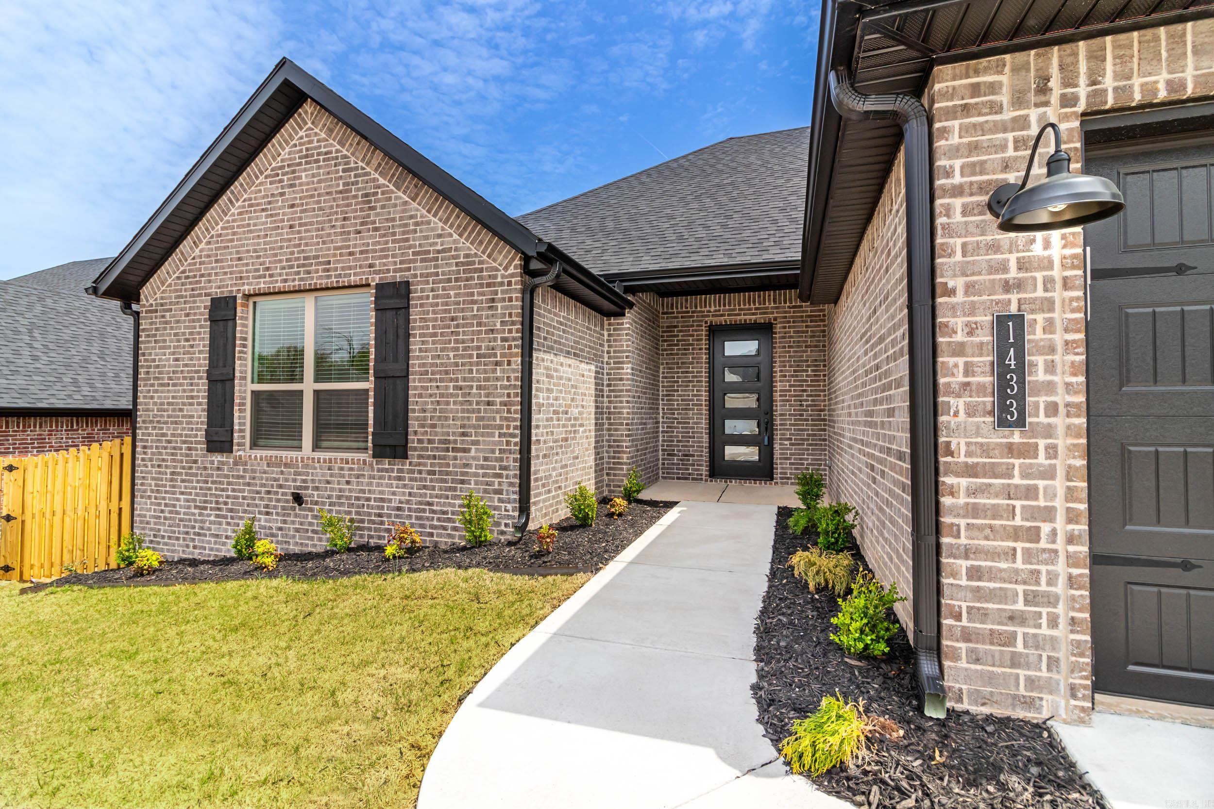 New construction, 3 bedroom 2 bath brick home with split floor plan! This house has 10" ceilings throughout, granite counters, natural light, low e windows, 2" faux wood blinds, insulated garage doors, and cellulose insulation. LR features hardwood flooring, tray ceiling, gas fireplace, and an open floor plan viewing the DR and Kitchen. Kitchen has lots of counter space for all your cooking needs, a walk-in pantry, stainless steel appliances, and an island with a breakfast bar! Great curb appeal with professional landscaping out front, full gutters, privacy fenced backyard, and a covered back porch with wiring for cable and plumbing for gas grill!