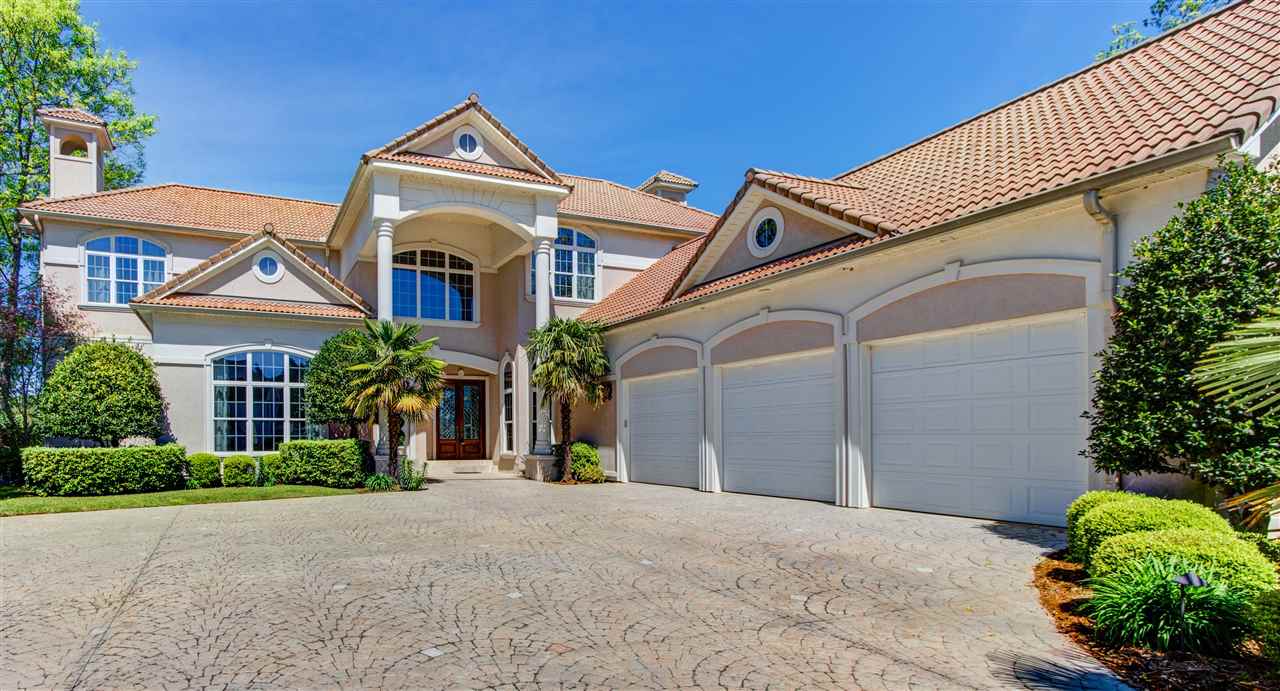 Magnificent Driftwood Point Estate. This stunning home sits on a nearly level lot with unbelievable eastern views. Soaring ceilings and quality craftsmanship throughout. Entertain family and friends in the chefs kitchen or in the wonderful outdoor kitchen area. Large open areas with views of Lake Hamilton from nearly every room. Your family and guests will enjoy the second level family area complete with small kitchen area. Exquisite details are showcased in the flowing floor plan.