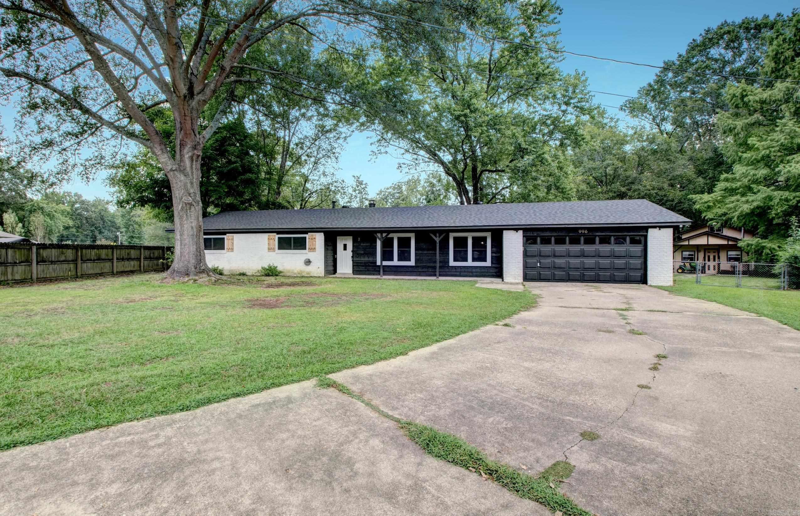 Don't miss out on this beautifully updated forever home! This property boasts a new roof and windows throughout, along with new LVP flooring and tile. A complete remodel! The kitchen has been recently updated with beautiful granite countertops and stainless steel appliances, and the Refrigerator conveys with home. Both bathrooms have also been updated with sleek, stylish tile and fixtures. (New Septic installed in 2024) The layout is perfect for family gatherings, entertaining friends, or holiday celebrations, complimented by a large covered patio/porch in the back, the spacious yard with mature trees offers a natural setting perfect for outdoor entertaining. As a bonus, there's a woodworking shop that could easily be converted into a mother-in-law suite, "man cave," "she shed," or even a game room for the kids and teens. This home is located in a quiet neighborhood, just minutes away from Benton and Bryant, providing easy access to shopping, dinning and all the happenings in Saline county. Don't miss out on this fantastic opportunity, BOOK your tour NOW!!