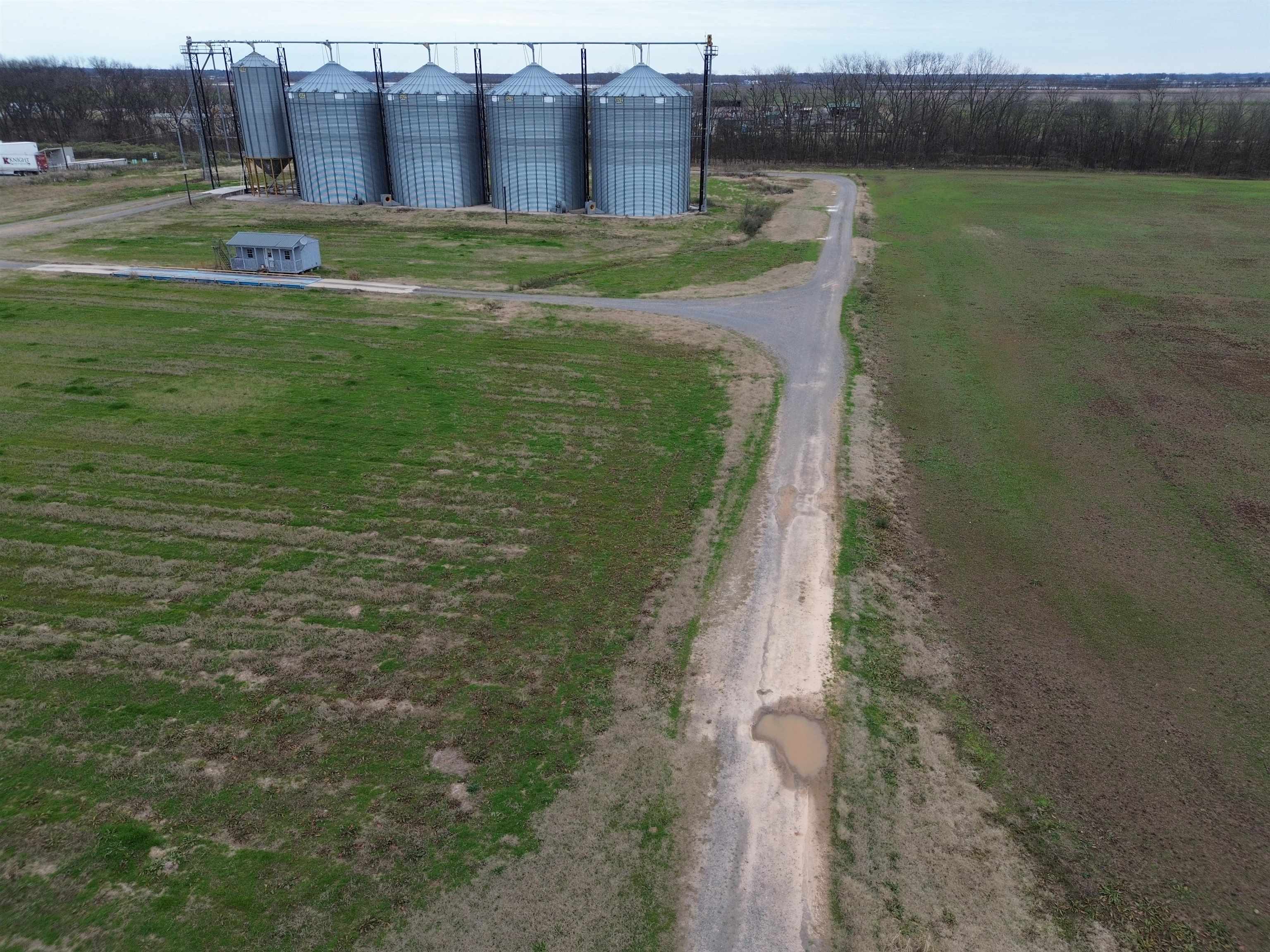 The Peoples Company of the Delta is bringing a great opportunity to the market. Located southeast of Pine Bluff, AR near the intersection of US Hwy 65 and Hwy 425, 4 grain storage bins of approx. 82,322 bushels capacity each and one wet tank capacity of 18,583. Annual lease in place at just under $90,000 per year with a renewal in spring of 2026. In addition is another 25 acres of tillable land leased at $90 per acre. With both leases in place, it makes for a very nice return with excess land to build more.