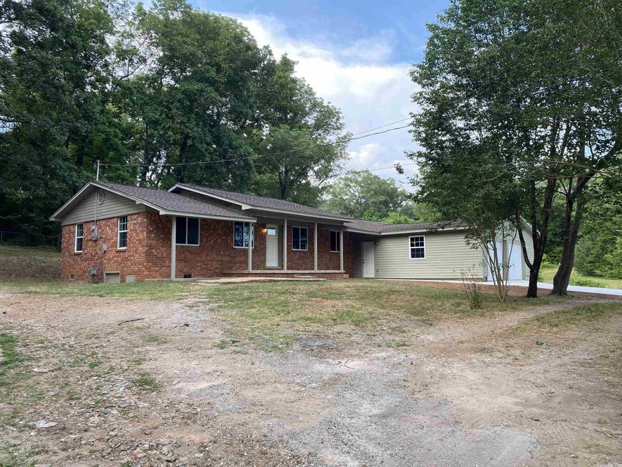 This beautifully updated home with an oversized 2-car garage with new doors is located just one mile from Magnet Cove Schools. The expansive lot offers ample space for outdoor activities such as gardening, playing with pets, or hosting barbecues with friends and family. The recently updated features in the house, such as new drywall, paint, fixtures and flooring, along with new cabinets, stainless steel appliances and butcher block countertops, provide a contemporary look and feel. In addition, the architectural shingle roof, new windows, insulation, water heater and new HVAC system make the house energy-efficient and comfortable throughout the year. The newly poured concrete driveway not only offers durability but also adds to the property's curb appeal. With five bedrooms and three bathrooms, this house is perfect for entertaining and hosting guests. The living area provides a comfortable and cozy environment for spending quality time with loved ones. This property has everything you need and is ready for new owners to make it their own. **Agents See Remarks**