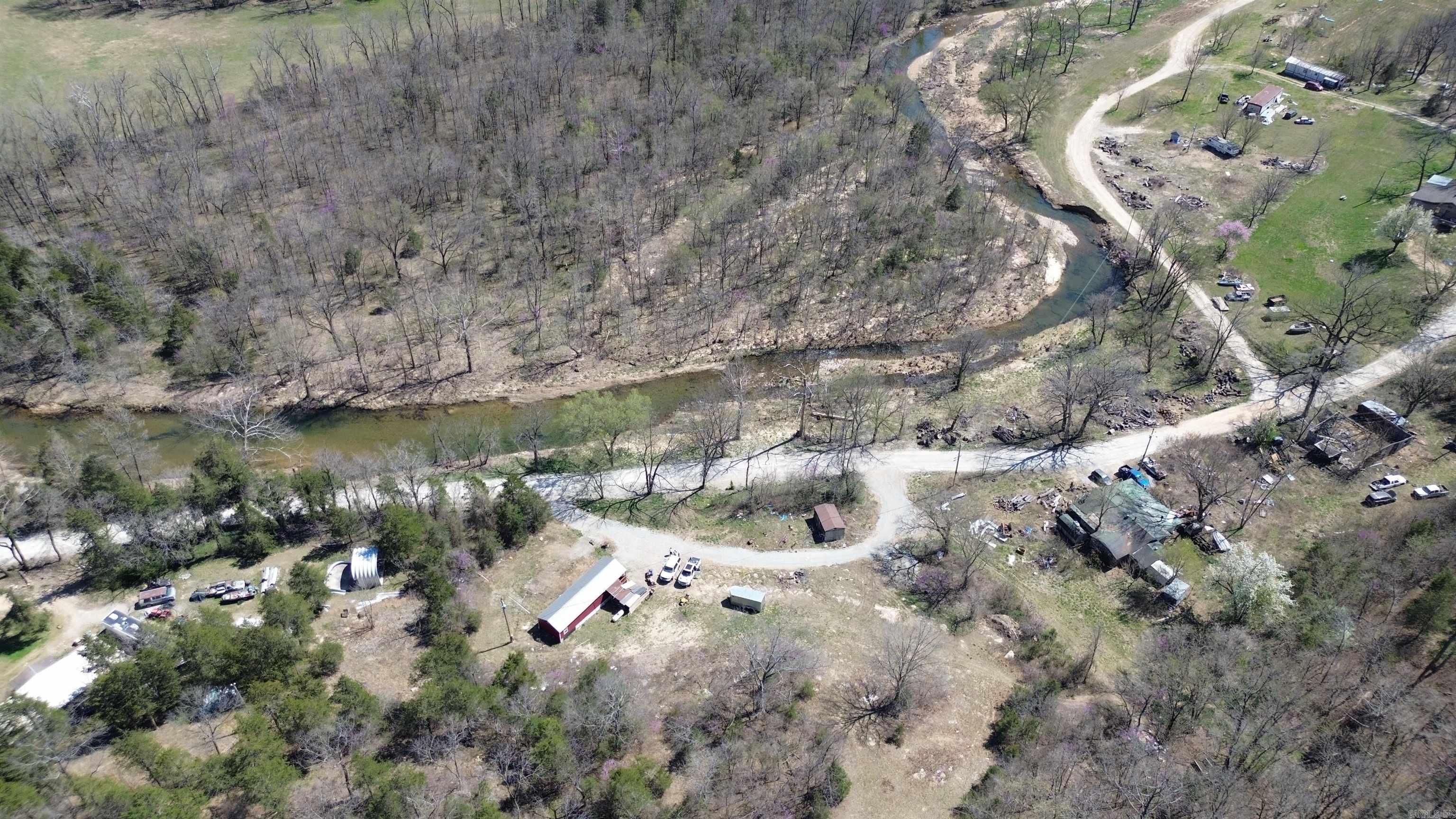 Escape to your own private retreat, this 5 AC M/L with a stunning year-round creek. Tucked away in a peaceful setting yet just a short drive from paved highway access, this property offers the ideal balance of seclusion and convenience. Located near Calico Rock and Norfork, youāll be close to outdoor adventures, fishing, and small-town charm. Enjoy morning coffee or evening relaxation on the front porch while listening to the soothing sounds of the creek. With plenty of parking and space to roam, this property is perfect for a weekend getaway, for a full-time residence, or vacation rental opportunity. Donāt miss your chance to own this slice of paradise.