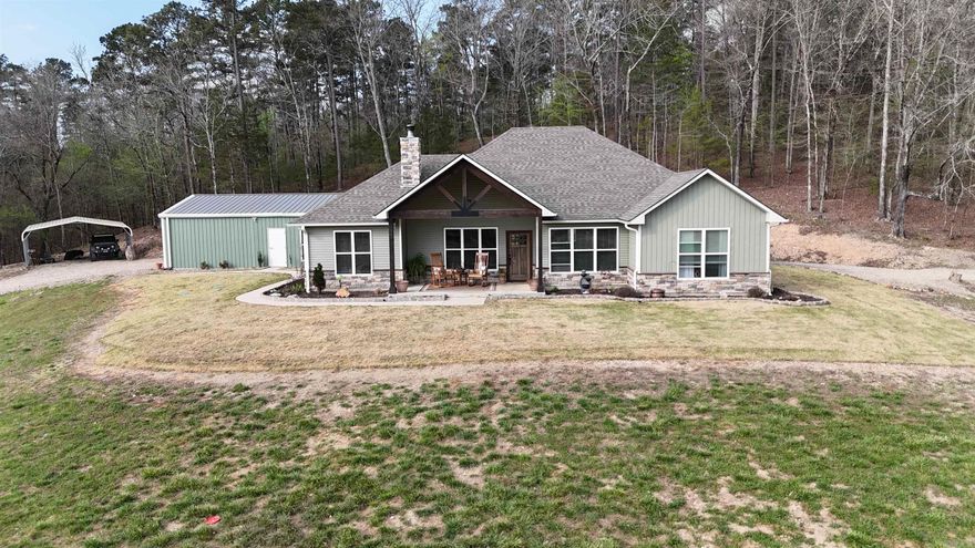 Secluded retreat, in the middle of this end of road location, located in the Ouachita Mountains, just a short ATV ride to Wolfpen Gap, this 40+ acre retreat offers privacy, views, and versatility. The 2023-built 3BR/2BA main home with office features an open floor plan, spacious kitchen with bar, coffee area, large pantry, and a private primary suite with custom shower and jetted tub. Enjoy mountain views from the front porch and relax on the covered back patio. A second 2BR/1BA home built in 1983 features semi-earth-sheltered construction and overlooks a stocked pond with dock. The land offers multiple creeks, an additional pond, pasture, wooded trails, and scenic hilltop views. Property includes a detached garage with climate-controlled gym, dog kennel/run, 28x42 Shop w/ 10' covered porch, multiple carports, both well & city water, a large garden with raised beds, & 10 fruit trees,  storage sheds, and a 12x28 art studio by the creek—making this a true must-see escape.