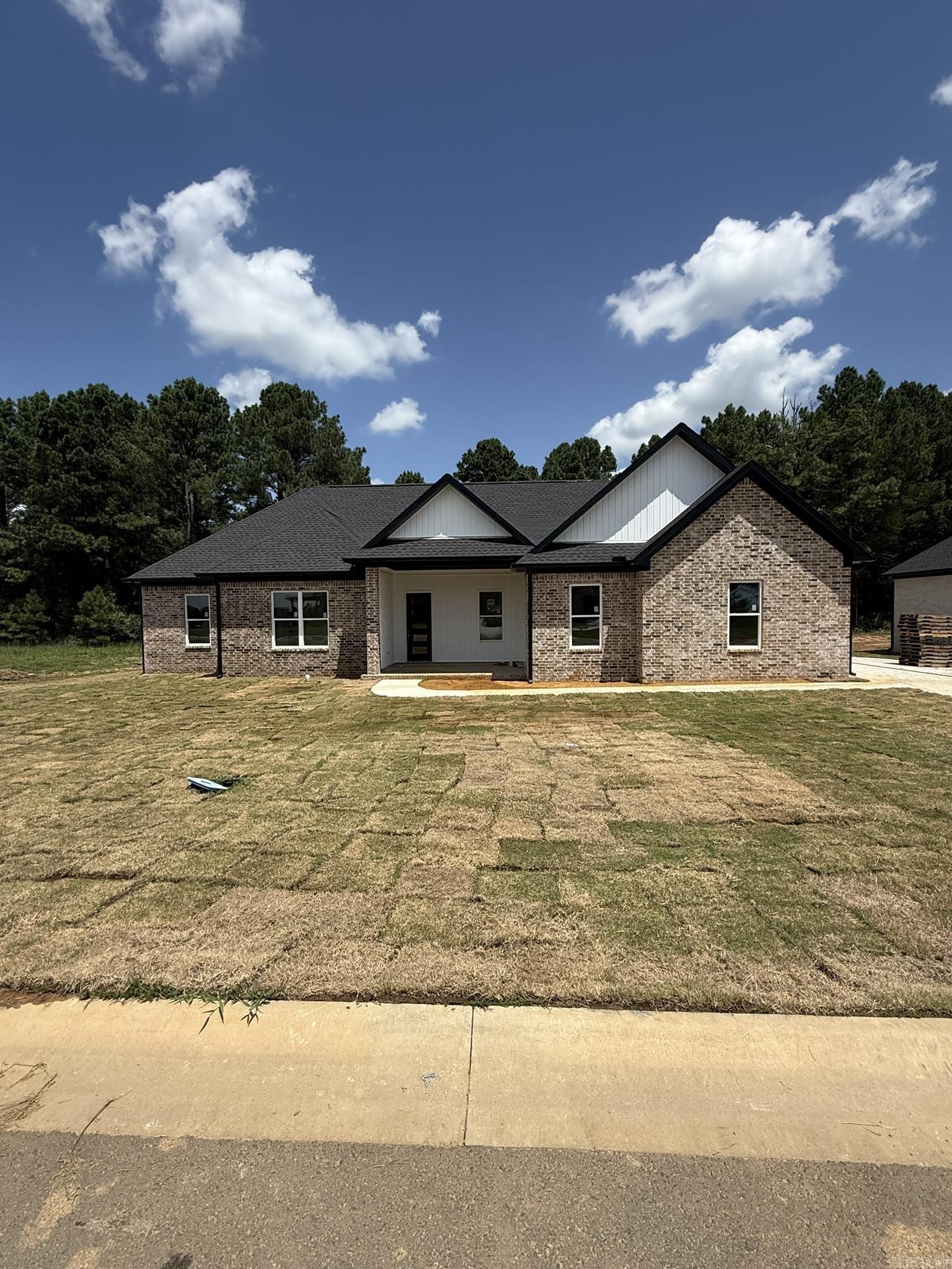 Located in the prestigious Belmont Estates and just minutes from Searcy Country Club, this stunning new construction home offers over 2,000 square feet of modern elegance and is nearly complete. Designed with an open floor plan and tall ceilings, the home features spacious, light-filled rooms, a modern fireplace in both the living area and the luxurious master suite, and a chefās kitchen with top-of-the-line appliances and sleek cabinetry. The master suite boasts a spa-like bathroom with dual vanities and a large walk-in closet for ultimate comfort and convenience. One of the standout features is the oversized side-entry garage, offering excellent curb appeal along with ample room for multiple vehicles, tools, and storage. With its clean modern design, high-end finishes, and meticulous attention to detail, this home is perfect for those seeking both luxury and functionality. Donāt miss your chance to make this incredible home your ownācontact us today for more information!