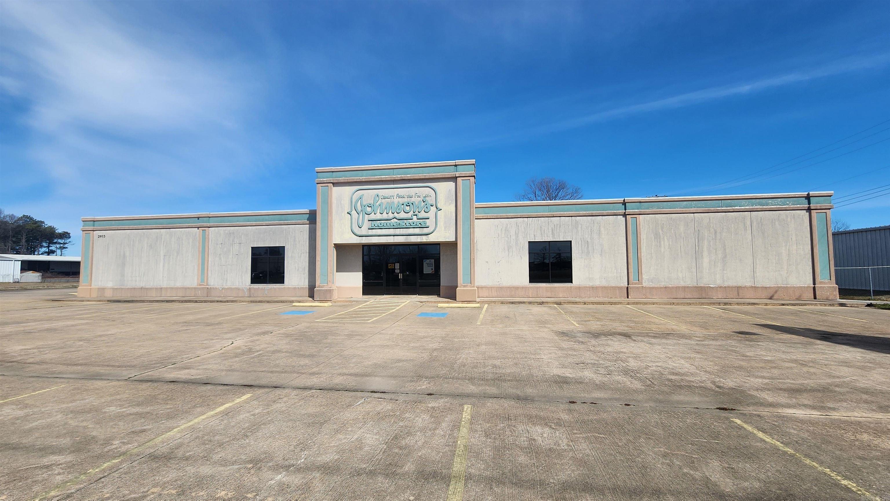 What a great opportunity this property is with so many possibilities! A HUGE open warehouse or showroom space is just the beginning. There are 3 private offices and 1.5 bathrooms. There is shelved storage space in the rear and semi truck ramp access with overhead doors. It is super close to area growth as well.