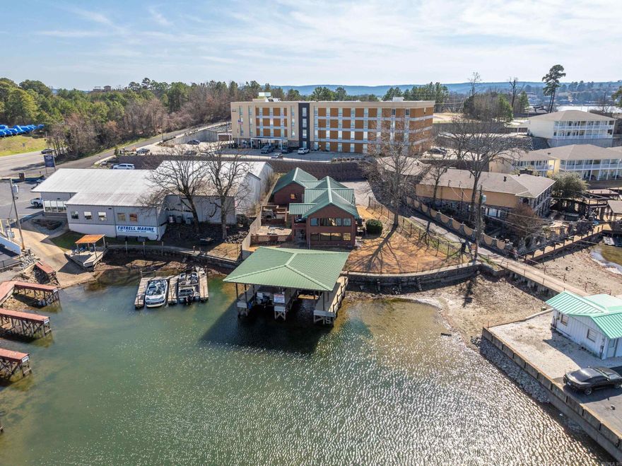 Lake Time! Excellent Location,Move In Ready! Situated on the serene waters of Lake Hamilton's main canal shores, just off marina circle in the highly sought 7 South area, walk to restaurants and marina area, remodeled with many updates, fully furnished, four bedroom, 2 1/2 baths with lots of storage, stainless appliances, nice patio area with outside stone fireplace on raised deck for entertaining family and friends, fenced yard, metal roof, 3 car garage, two stall covered boat dock with lift, concrete seawall, currently used as a VRBO but make it your permanent getaway! Close to Oaklawn Park and downtown Hot Springs! Lakeside Schools. Check this one out!