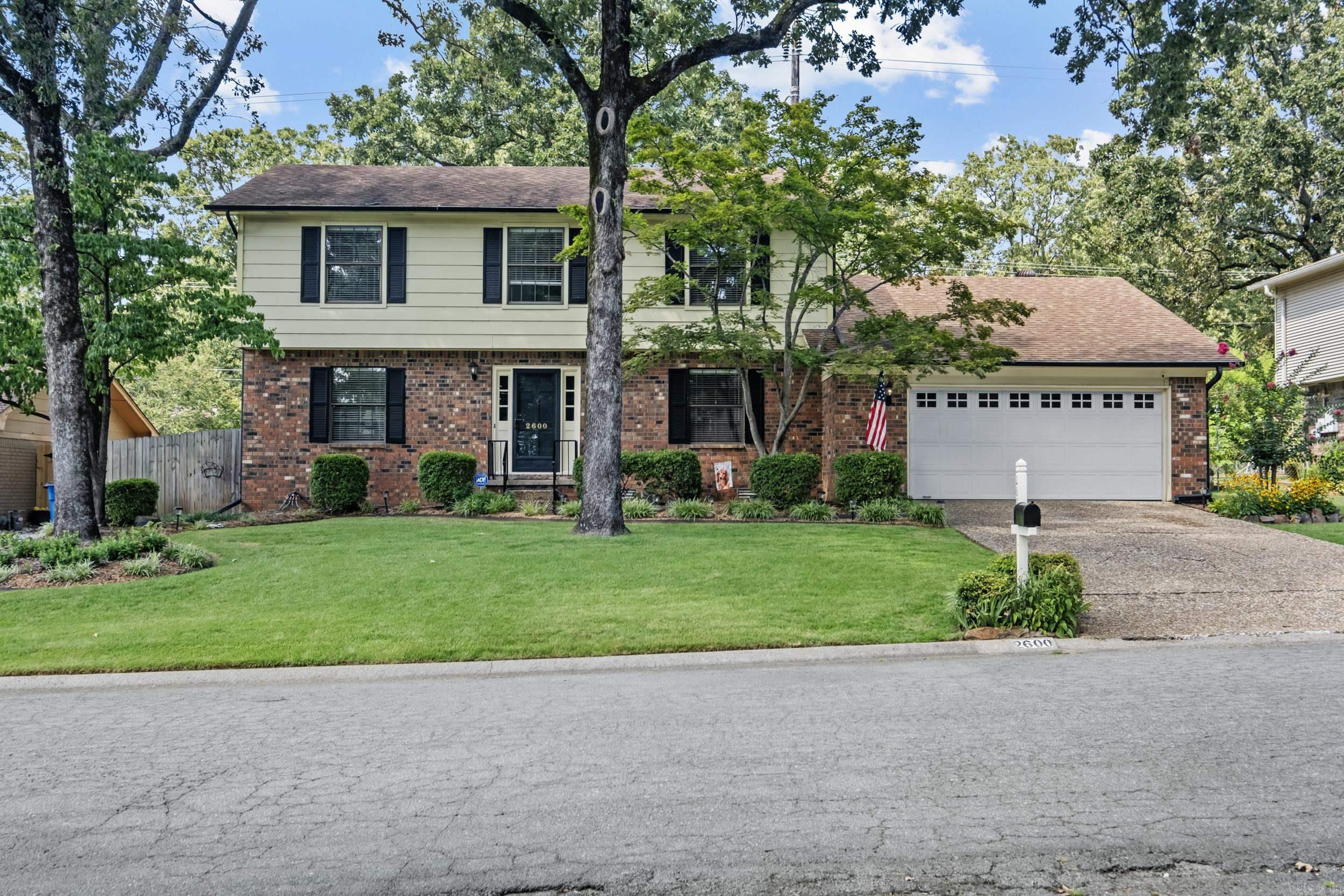This stately 4 bedroom, 2.5 bath home offers abundant space for everyone! The main level features a spacious office, a formal living area and a dining room perfect for entertaining. The large kitchen, with breakfast nook, is open to the family room and includes a walk in pantry, plenty of storage, and an additional closet. The inviting family room boasts custom built-in shelving and a cozy fireplace with gas logs. A screened-in patio extends your living space outdoors, overlooking the large level, fully fenced backyard- ideal for gatherings, play, or pets! A convenient half bath completes the main floor. Upstairs, you'll find 4 generously sized bedrooms. The primary suite features a walk in closet and ensuite bath. The three guest rooms share the hall bath.Additional highlights include a 2 car garage and an unbeatable location in desirable Overbook.