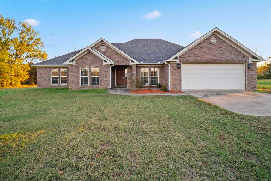 This custom built home offers 4 bedrooms and 2.5 baths, situated on 2 acres just minutes from Morrilton city limits. It features tile and laminate plank flooring, with carpet in the bedrooms. The living room includes built-ins and a fireplace, while the spacious eat in kitchen and formal dining room are perfect for large gatherings. Outside, you will find a covered back patio, in ground storm shelter, and a shop with with electricity and an outside water spout.