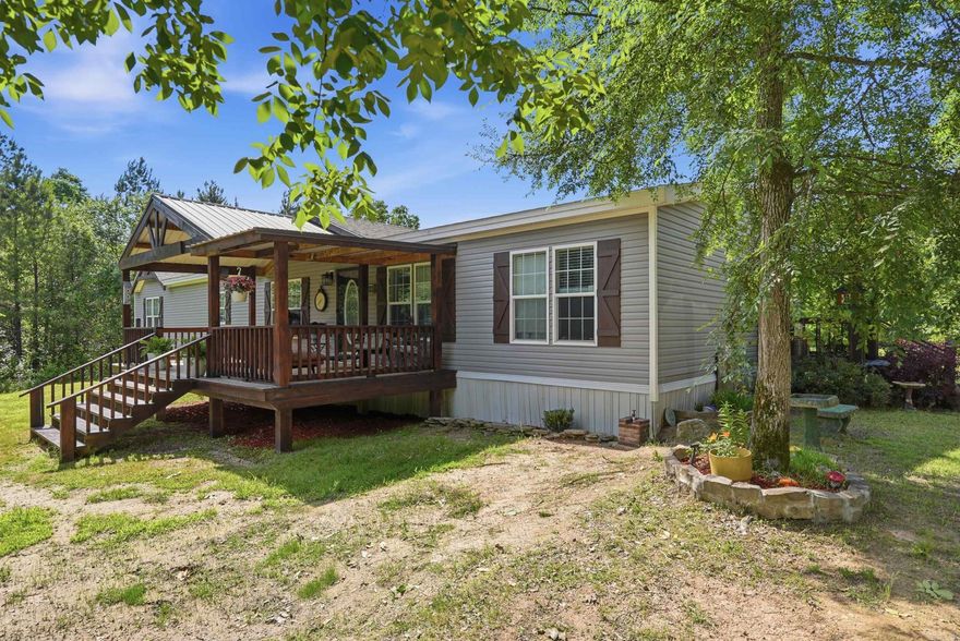 Tucked away on a private drive in White Hall, this spacious 3 bedroom, 2 bath double wide sits on 6 beautiful acres offering the perfect blend of privacy and comfort. Inside, you’ll find an open floor plan with two separate living areas, each featuring its own fireplace — ideal for entertaining or creating cozy spaces for the whole family. The split layout provides functionality and flexibility, while the peaceful acreage offers endless opportunities for outdoor living, recreation, or simply enjoying the quiet country setting. If you’ve been looking for space, privacy, and a home with character, this one is a must-see!