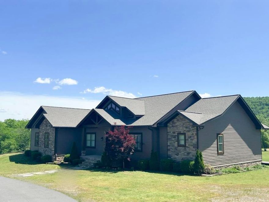 This exquisite 5-bedroom, 3.5-bathroom home, custom-built in 2017 by Pat Usdrowski, offers luxurious and functional living spaces on 2 acres +/-. Enter through a grand entryway into a stunning living room with high ceilings, wooden beams, and custom built-ins surrounding a floor-to-ceiling stone gas log fireplace. The chef’s kitchen features a walk-in pantry, stainless steel appliances, granite countertops, a stone tile backsplash, and a spacious island. The front room is versatile, suitable as a formal dining area or playroom, and an office is conveniently located nearby. The laundry room boasts a counter, sink, and hall tree storage. The master bedroom has a tray ceiling and doors leading to the back deck. The master bath includes a granite double vanity, walk-in closet, and slate shower with double showerheads. Upstairs, find two guest bedrooms sharing a Jack-and-Jill bathroom. The downstairs area includes a living room with a projector, a bar kitchen area, two bedrooms, a bathroom, a gym bonus room, and an 882 sq. ft. bonus room. New roof April 2025! Located in the Lakeside School District, this home combines modern amenities with a tranquil setting. Appraisal on file.