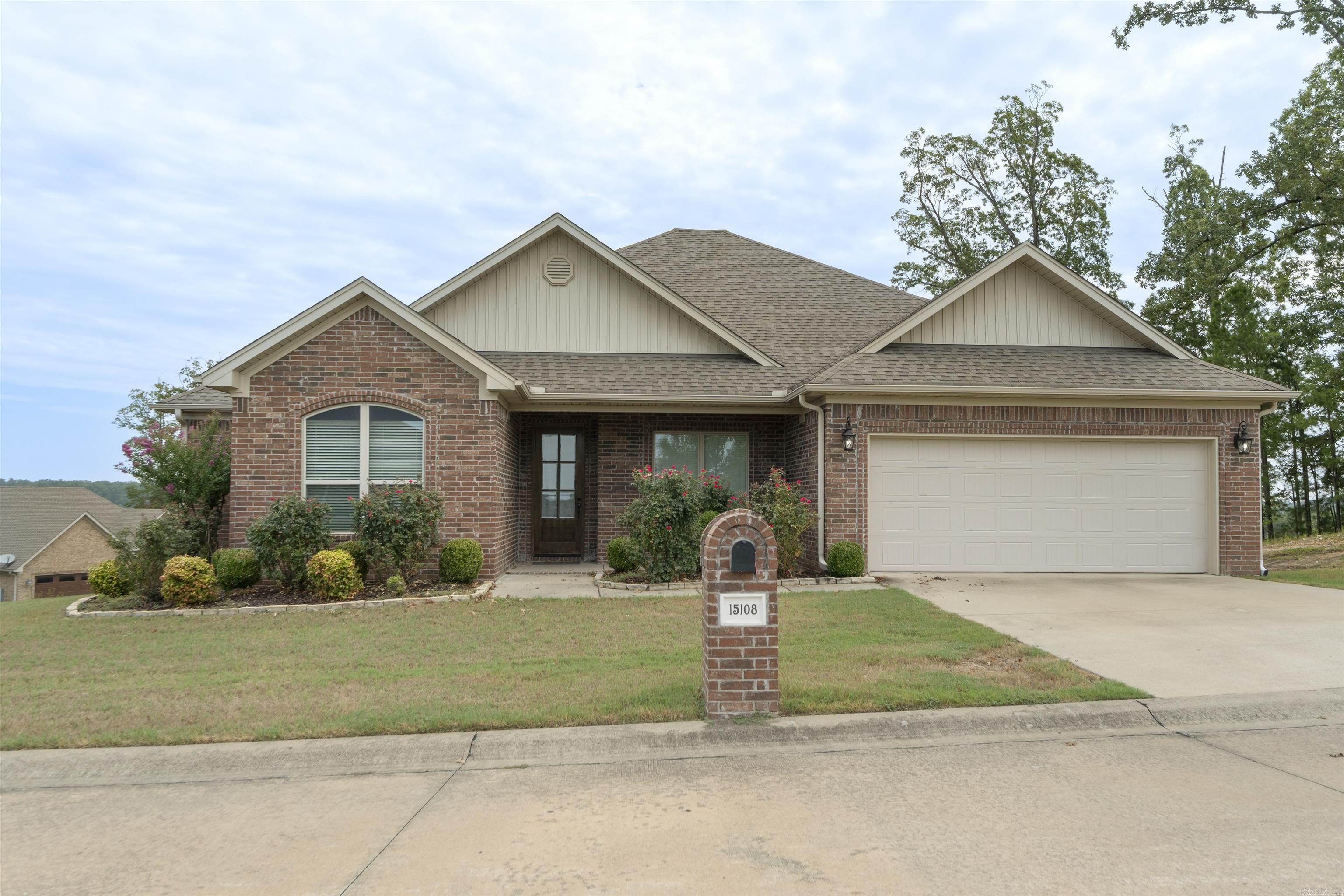 Welcome to this beautiful one-level home in the gated Lochridge Estates community! This 3 bedroom, 2 bathroom split-floorplan sits on a spacious .48 acre corner lot with peaceful pond views. This open 2,147 sqft. layout features dark oak floors, a cozy living room with gas fireplace, and separate dining. The kitchen offers granite counters, breakfast bar, stainless appliances, and gas range. Spacious primary suite includes a wood-beamed tray ceiling, double vanity, walk-in rain shower, and large walk-in closet. Looking to relax and/or entertain? Enjoy the spacious covered patio with sunrise pond views. This home features a low-maintenance brick exterior and is in a gated community setting. What are you waiting for? Make this home your wonderful retreat in West Little Rock and book a showing today! Agents See Remarks!
