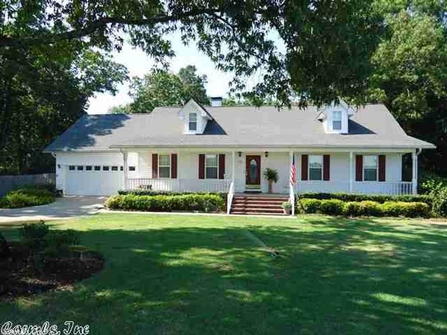 The all electric 2 story home sits across from DeGray Resort Golf Course.  This home features 35' x 17' inground pool, $10,000.00 metal shop, custom build wood burning fireplace with built in library shelving, party room with 4-picture windows, large game room downstairs, wooden deck, antique white kitchen cabinets, formal dinning area, insulated windows, insulated doors, 4" crown molding, hardwood, carpet, tile floors, updated walkin ceramic tile shower. The owner has added about 1600 sq. feet to this home