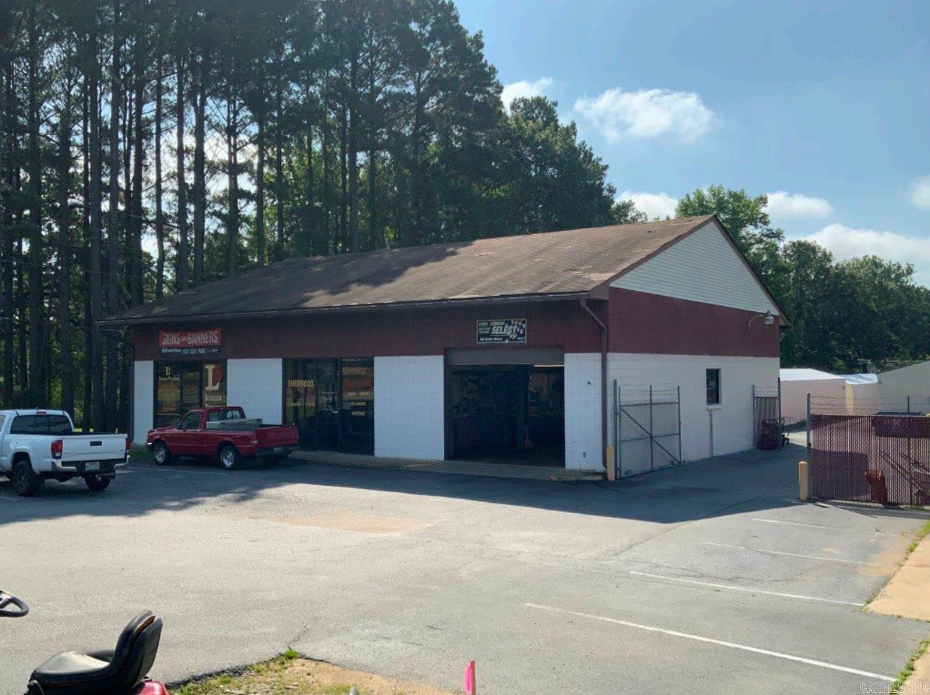 For sale: A ±3,168 SF masonry/concrete block commercial building located on a ±0.27-acre portion of a ±0.83-acre parcel with direct frontage on Arkansas Highway 107 in Sherwood, AR. Built in 1993 and in average condition, the building features upgraded LED lighting and is scheduled for a new metal roof in 2025. The property includes a ±2,068 SF owner-occupied service center with an ±850 SF garage (16’ ceiling, two overhead doors), ±168 SF storage room, and ±1,050 SF heated/cooled office, plus a ±1,100 SF retail suite currently leased on a month-to-month basis and fully heated/cooled. A ±0.48-acre access easement provides ingress/egress from Hwy 107 to an adjacent storage facility under shared ownership. This location offers excellent visibility, on-site parking, flexible commercial use, and immediate income potential. Contact Arkansas Land Company for pricing and a private showing.