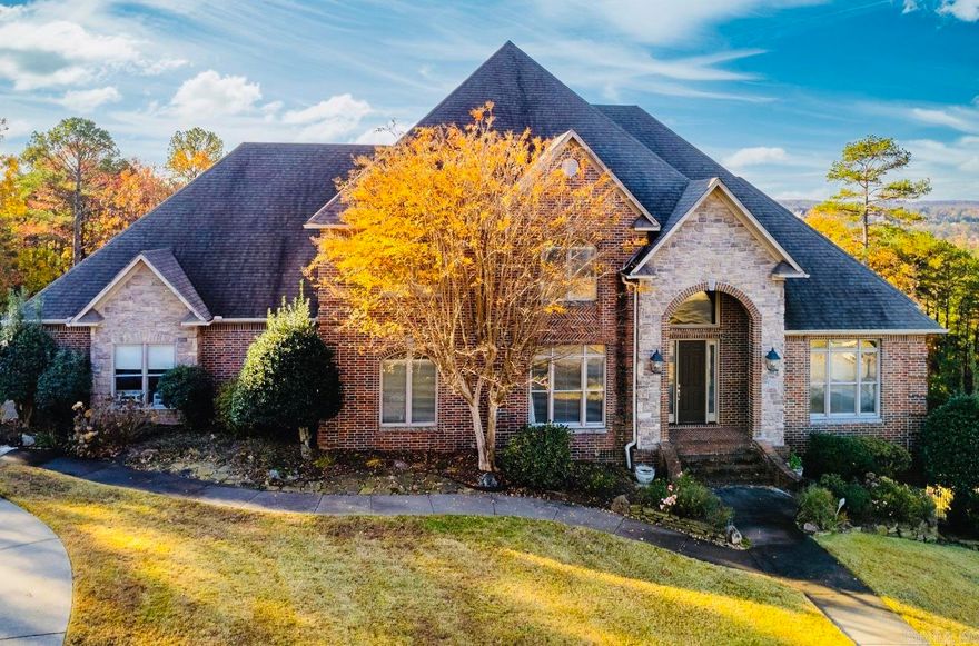 Desirable LaMarche home on nearly one acre! Elegant entry opens to a large office with natural light and a formal dining room. The great room features a gas-log fireplace and wet bar, open to the chef’s kitchen with stainless 5-burner cooktop, double ovens, microwave, and granite countertops. The breakfast bar connects to the hearth room with a second fireplace and casual dining area. Main-level primary suite with double vanities, tub, shower, and large walk-in closet. Also on the main level: guest bedroom with bath and walk-in closet, plus a spacious laundry room. Upstairs offers a large game room, three bedrooms, and two full baths. Enjoy outdoor living on two decks overlooking a privacy-fenced yard with sprinkler system. Three-car garage and abundant storage throughout plus two underhouse storage areas. This home is perfectly designed for comfortable family living and ready for your finishing touches! Agents see confidential remarks.