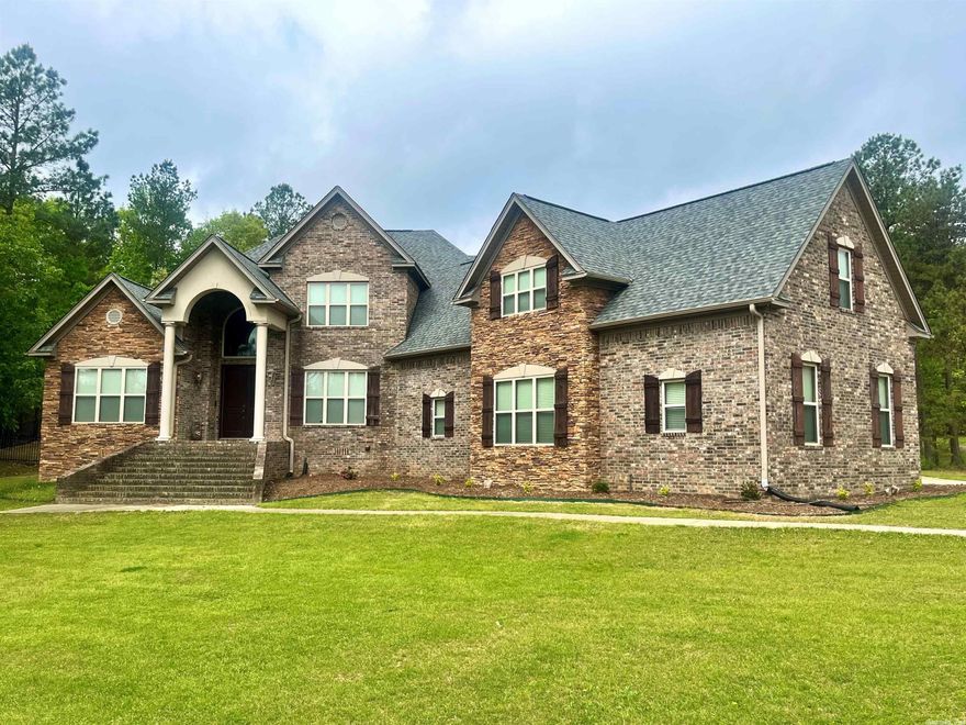 Welcome home to 7011 Gemstone! This exquisite home is located in highly sought after Stonehill Estates.  The expansive floor plan has an immense amount of natural lighting and storage. A large family room has a beautiful gas fireplace and tons of built-ins with a wall of windows overlooking the backyard oasis. Stunning granite countertops, stainless appliances, double oven, under counter ice maker, and gas range all compliment the beautiful chef's kitchen. Split downstairs floor plan with Master bedroom and separate in-law suite are perfect for peace and privacy.. Upstairs offers a huge bonus room along with 3 bedrooms and 3 bathrooms! A fully fenced back yard with covered porch and woodburning fireplace overlook the luxurious saltwater pool. This home is an absolute dream for anyone who loves to entertain and enjoys watching wildlife right out their window. Storm shelter, tankless hot water, gutters, and a brand new roof in 2022 are several of this homes fabulous extras. You must see! See agent remarks.