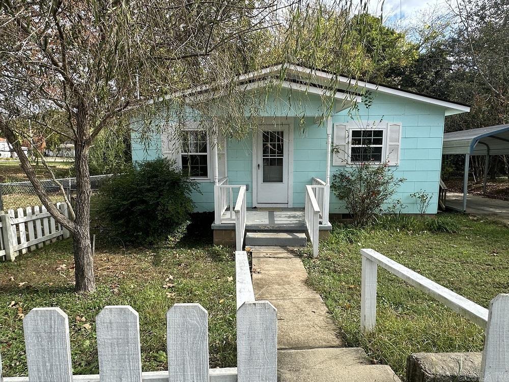 Cute 1956 Bungalow walking distance to downtown Heber Springs. Many upgrades such as energy efficent vinly windows, wood look vinyl flooring throughout, Lenox HVAC unit, architectural shingles, 40 gal water heater, metal carport, concrete driveway and storage building. Small fenced in area for pets and little wet weather creek behind the property. The perfect starter home, weekend get away or rental property. Driveway with metal carport & storage building are located in the alley. See Agent Remarks