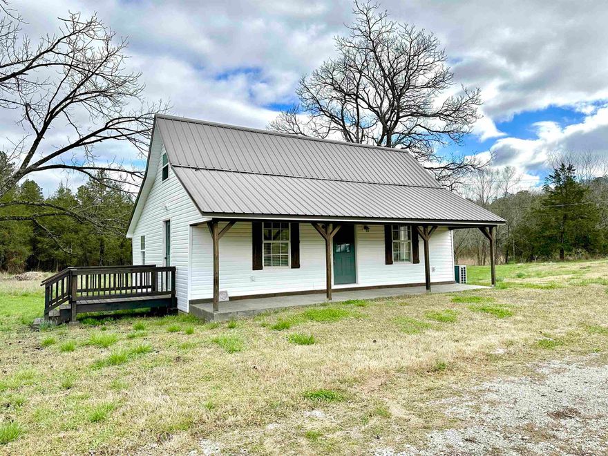 COMPLETELY REMODELED HOME on 3.24 acres in Melbourne! This cute "farmhouse" styled home has been remodeled inside and out within the last 2 years! The home has all new custom cabinets, quartz countertops, all new bathroom with tile surround shower and custom vanity with granite countertops, new siding, roof, flooring, fixtures, ductless heating/cooking system, and so much more! This home features an open floor plan with stainless appliances, 2 spacious bedrooms plus an open loft that could be used as a third bedroom or storage space. Outside the home is a seasonal spring, running majority of the year, fenced in area, storage building, and large open yard for gardening or animals. Comes with all furniture that you see! The home does have a new well that was just dug along with fiber optic internet! Located a short drive to the area creeks & White River!