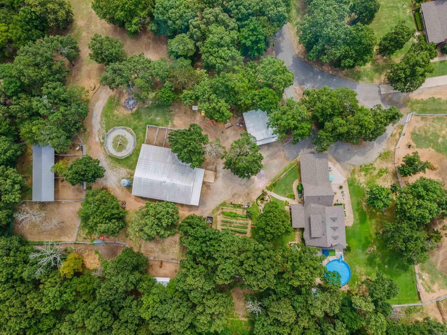 Rare find.  109 Acres of the best land out there.  PLUS two homes.  The larger home is 3100 sq ft, 4 beds, 3 baths, two living areas, large dining room, kitchen with breakfast, craft room, wrap around porch, above ground pool.  Second home is 1958 sq ft, 3 beds, 2 baths, additional living area.  Shop building is 30 x 60, overhead door and walk thru door, side lean to area.  Covered parking carport for large camper and horse trailer.  Arena, pasture is fenced and cross fenced.  Horse barn with open middle walk thru and 9 stalls, 4 of them turn out stalls,  tack room, feed room.  Additional barn.  This property is one of a kind. Perfect for the ones who want to be in the country, yet close to everything.