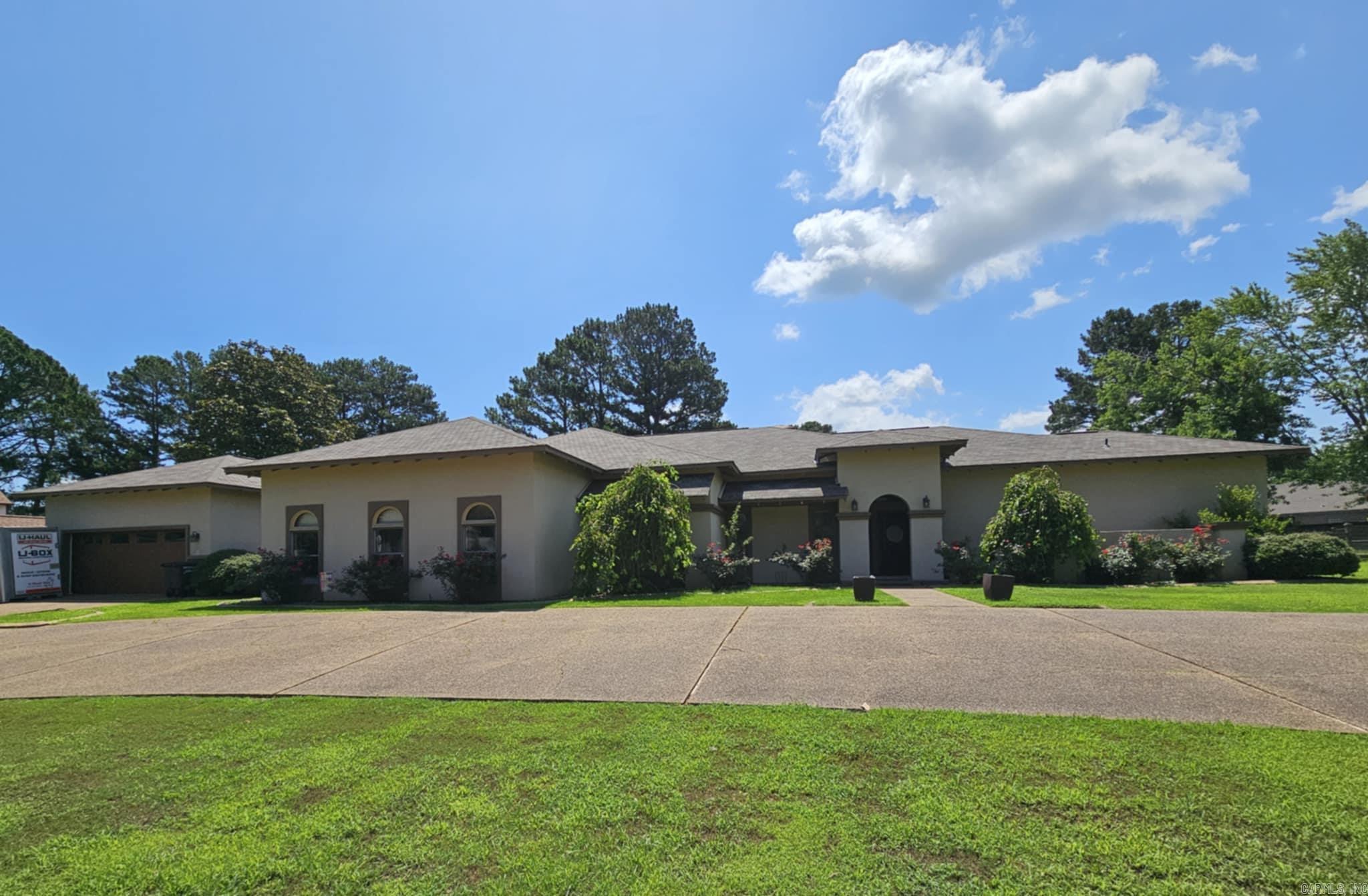 This stunning home truly has it all! Featuring 4 spacious bedrooms and 4 bathrooms in a well-designed split floorplan, it offers a perfect blend of comfort and functionality. Enjoy the elegance of a formal living room and a cozy den, both warmed by a beautiful double-sided fireplace. Entertain effortlessly in the large bonus/game room complete with a wet bar and full bathroom, or work from home in the bright sunroom, ideal as an office space. The kitchen is a chef’s dream, boasting granite countertops, stainless steel appliances, a large chef’s fridge, butcher block center island, double ovens, and abundant cabinetry for storage. Retreat to the enormous primary suite with a luxurious bathroom featuring a soaker tub, spacious walk-in shower, and dual vanities. Step outside to the covered back patio — an entertainer’s paradise with ample seating, an outdoor grill, fireplace, and a playset for the kids. Situated on a double lot overlooking the 17th hole of the golf course this home also offers ample parking that includes a two car garage, two bay golf cart parking and a convenient circle driveway. With space, style, and premium amenities, this home is a true must-see!
