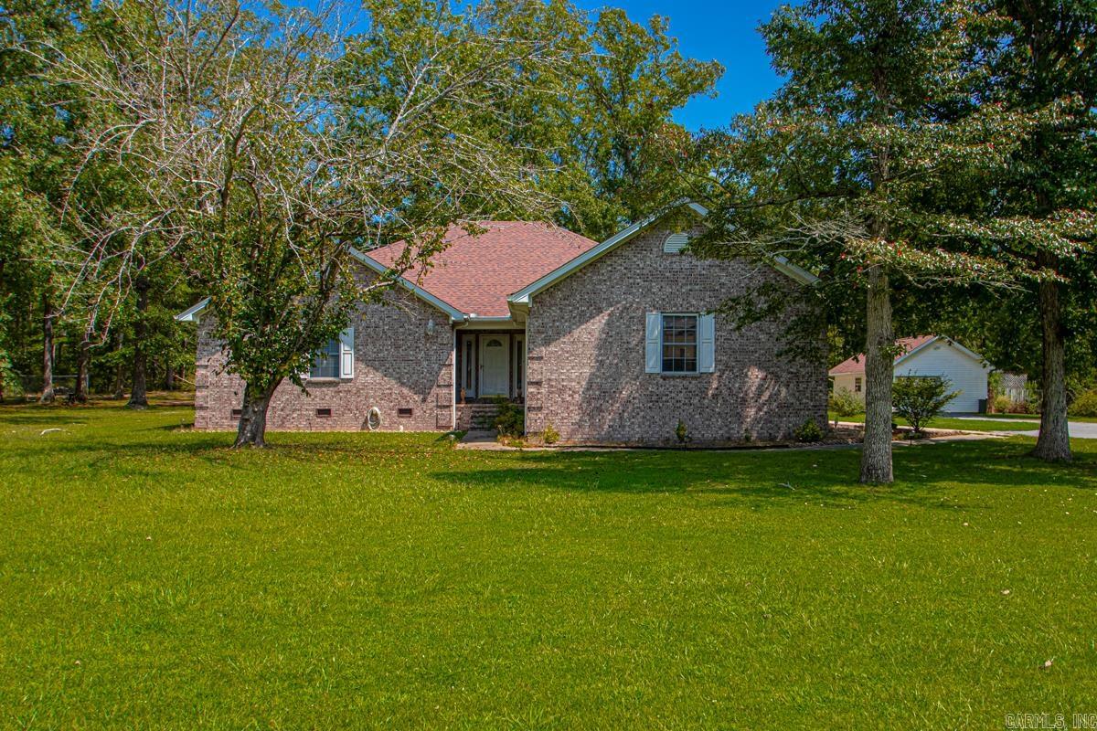 Welcome to this immaculate, one-owner home, serene country living with convenient access to town. This beautifully maintained 3-bedroom, 2-bath property is a testament to quality and thoughtful design, offering a spacious and comfortable lifestyle. Upon entering, you'll be greeted by a bright and expansive living room, featuring a cozy gas fireplaceāperfect for relaxing evenings. The semi-open floor plan seamlessly connects the living area to the kitchen and dining room, creating a perfect space for entertaining. The kitchen is a chef's delight, with a convenient bar area, two lazy Susans, and ample counter space for all your culinary endeavors. A generously sized walk-in pantry provides exceptional storage, while the adjacent, separate laundry room is large enough to accommodate a washer, dryer, and even an extra freezer. The bedrooms are all notably spacious with large closets and walk-in areas. The luxurious primary suite is a true retreat, boasting a large bedroom and a private en-suite bathroom complete with a Jacuzzi tub, a separate standalone shower, and a substantial walk-in closet. Step outside to a tranquil, large covered back porch. Shop and Generator! Large back porch.