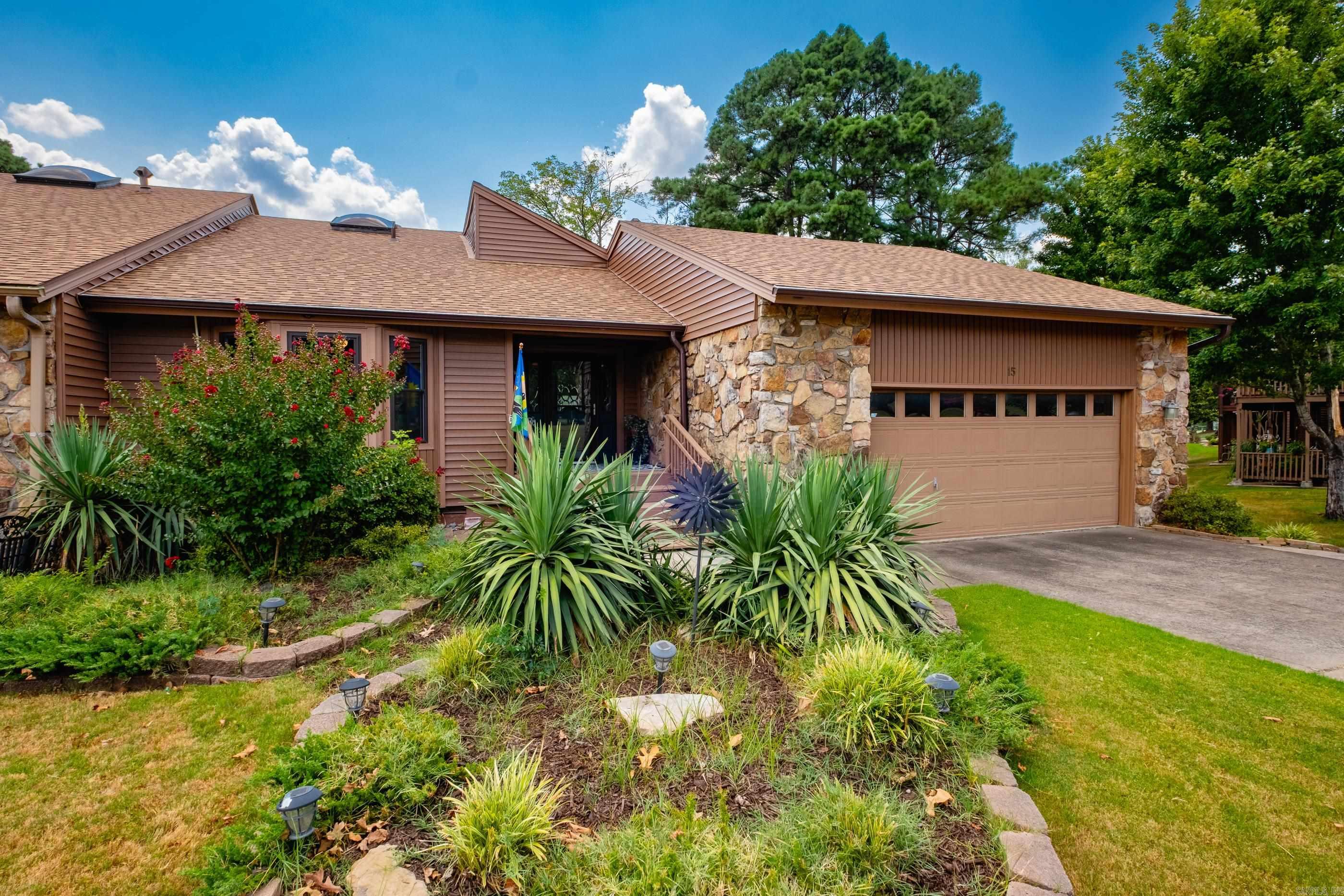 Stunning property on Maumelle Country Club golf course! This home is located on the 9th fairway & a delightful retreat for anyone! Beautiful views (front & back) & many places to relax or entertain. Interior boasts high/vaulted ceilings w/ exposed beams & so much natural light through the updated windows & sliding doors, leading you out to the wrap around decks & screened porches. On the main level is a spacious kitchen w/ granite counters, big living with fireplace & hardwoods, primary suite has hardwoods & views of the course plus a bright bathroom includes huge walk-in tiled shower, double vanity, soaking tub & two closets. At the front of the home is a generously sized guest suite w/ bath. Downstairs has a game/bonus room w/ a 2nd fireplace & access to lower decks, big wet bar area, 2 guest bedrooms share a bathroom & the laundry room leads out to the heated/cooled golf cart garage or workshop. Under house storage galore! **Roof & Leafguard Gutters recently replaced.