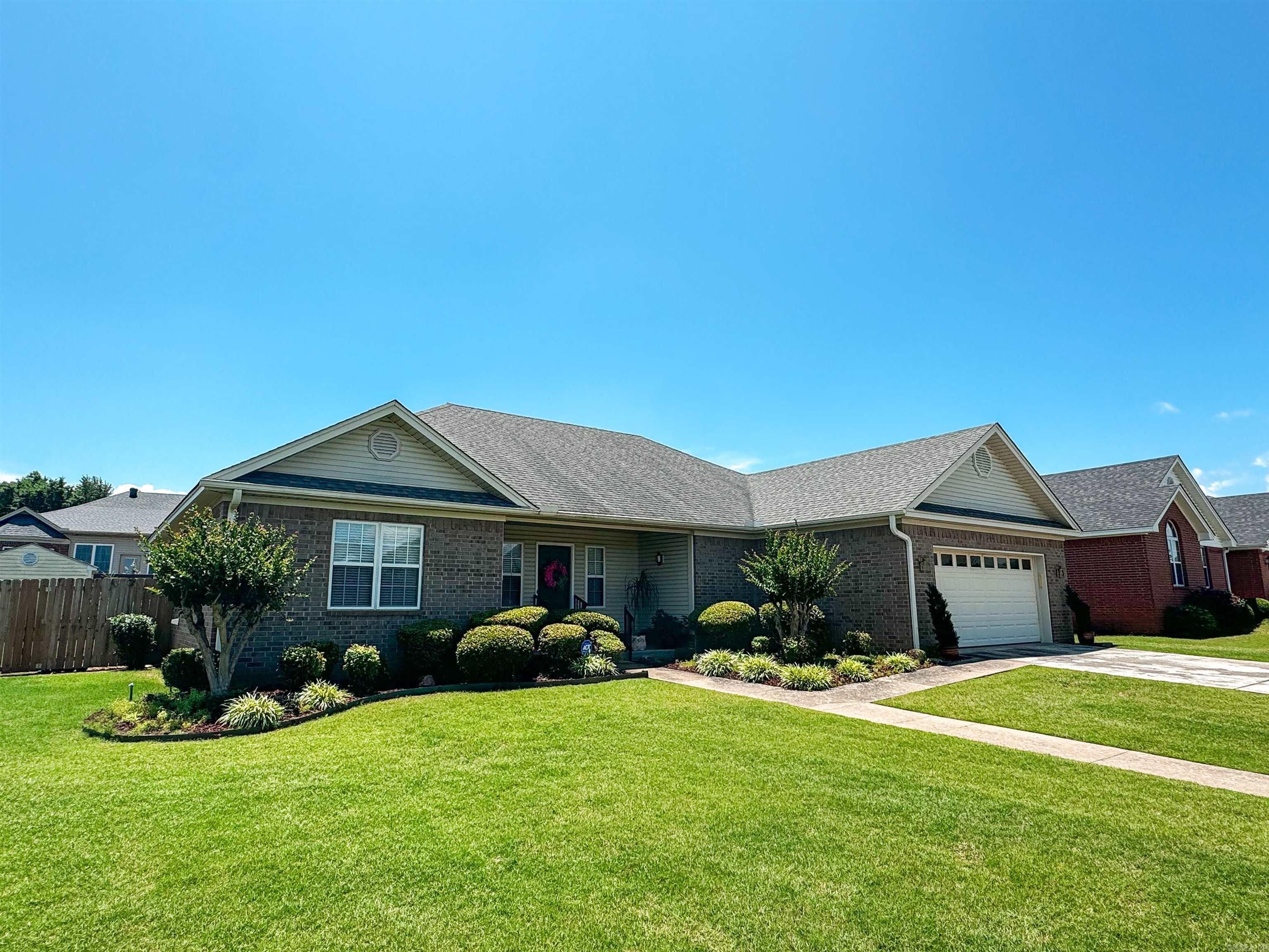 This beautiful home has been very well maintained & is move-in ready! Upon entering the front door, you'll notice the taller ceilings in the spacious foyer with two coat closets, crown molding in most of the home, closets galore, and newer laminate floors. This house also features a spacious living room, newer appliances, large laundry/mud room with storage closets, split floor plan & More. The primary suite features two walk-in closets in the bathroom plus two more closets in the bedroom, a safe-step jetted bathtub, two sinks, separate shower, tray ceilings & a built-in desk. This neatly manicured yard has a sprinkler system, a nice covered patio in the back as well as a privacy fence, and a great storage building! AGENTS please see remarks for more details and showing.
